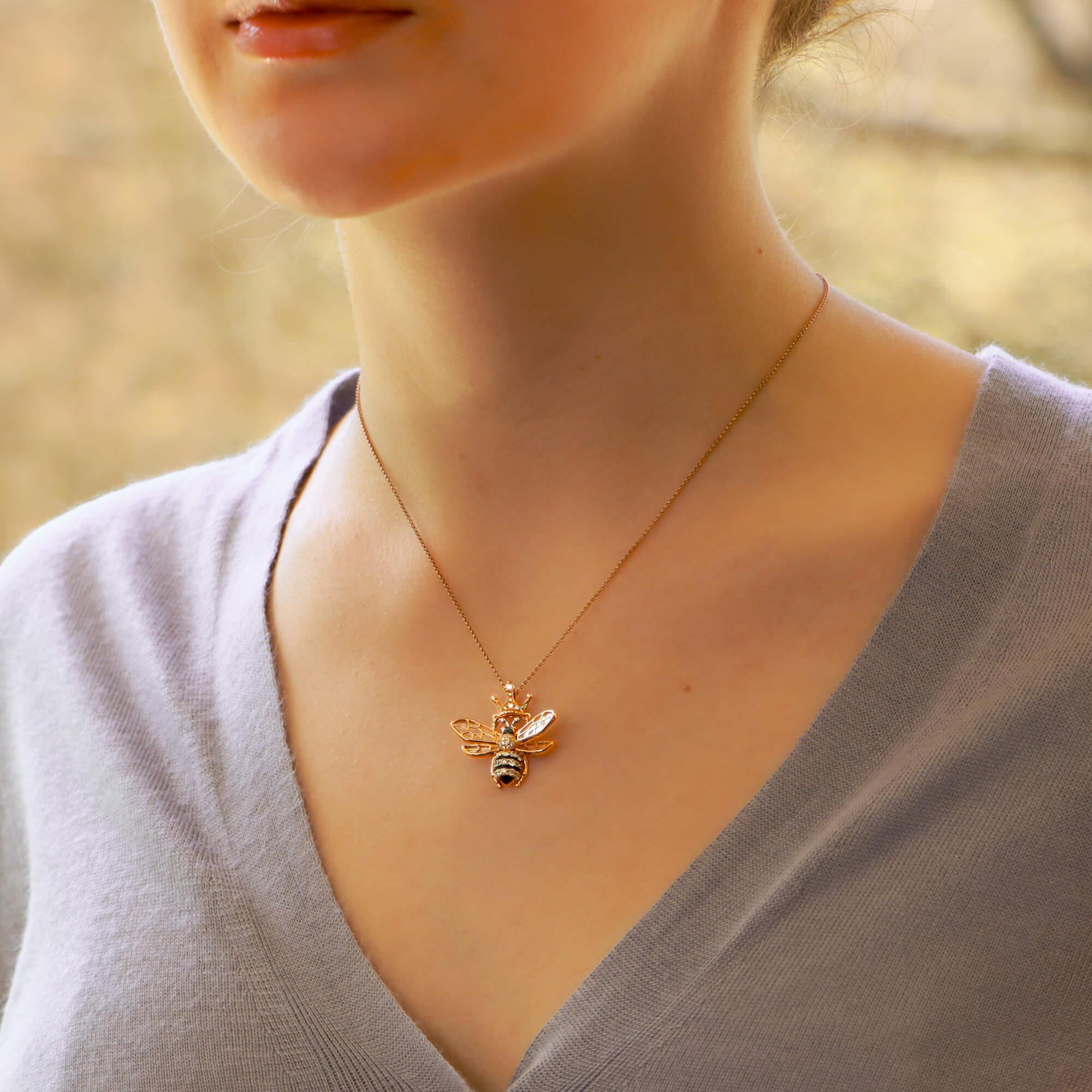 An exquisite Queen Bee diamond and mother-of-pearl necklace set in 18k rose gold.

The necklace is predominantly set with a central rose gold bee which is set throughout with white and black round brilliant cut diamonds amongst a black enamel inlay.