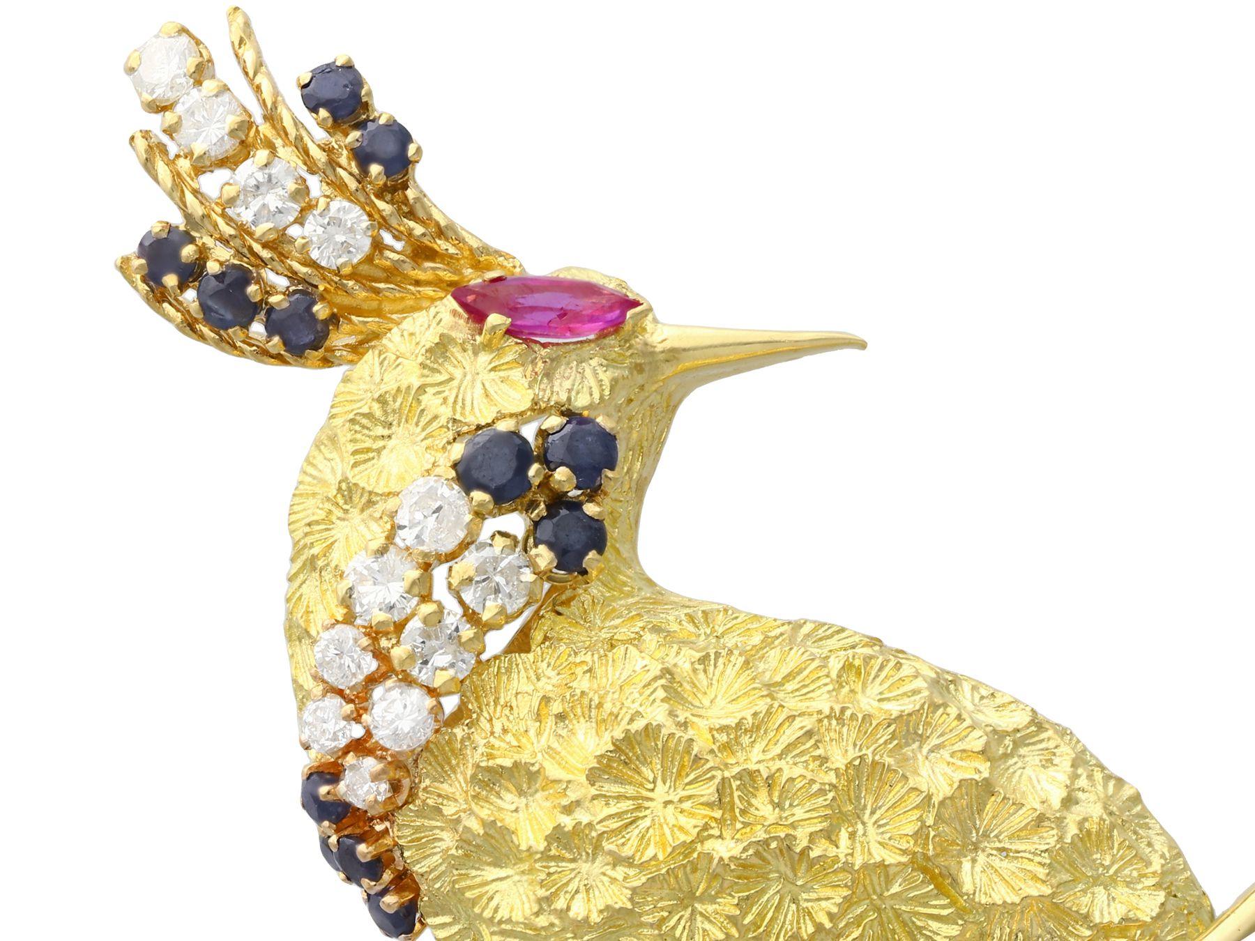 A stunning, large and impressive 0.42 carat diamond, 0.28 carat ruby and 0.45 carat sapphire, 18 karat yellow gold peacock brooch; part of our diverse jewelry collections.

This stunning, fine and impressive brooch has been crafted in 18k yellow
