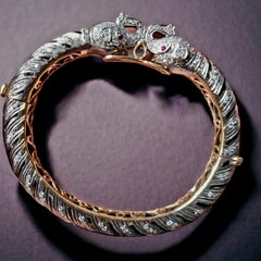 Diamond, Ruby, Black Enamel Elephant Heads Bangle Bracelet (First quarter 20thC)