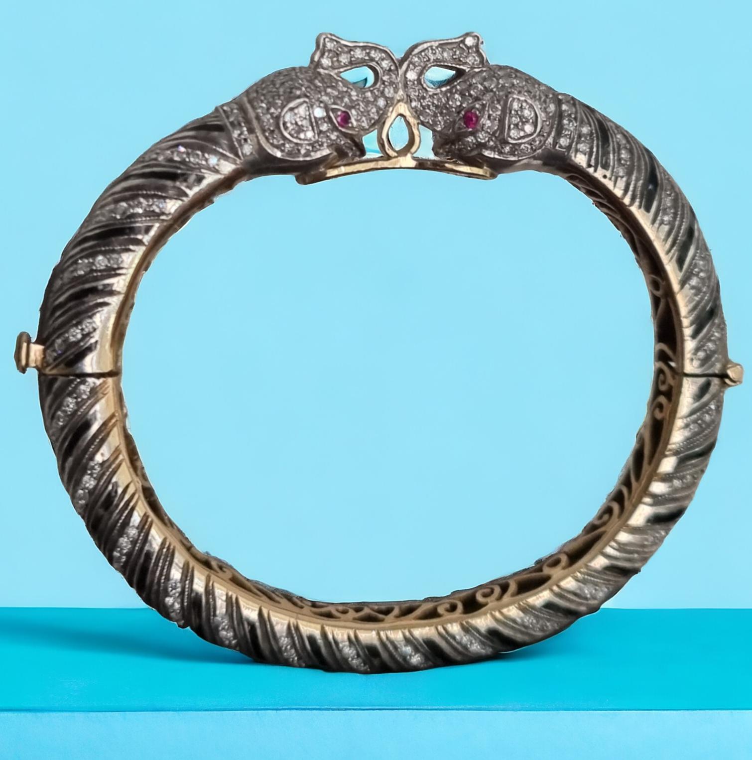 Anglo-Indian Diamond, Ruby, Black Enamel Elephant Heads Bangle Bracelet (First quarter 20thC) For Sale