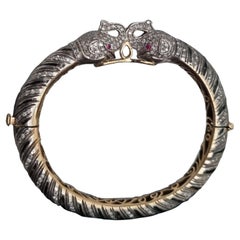 Antique Diamond, Ruby, Black Enamel Elephant Heads Bangle Bracelet (First quarter 20thC)