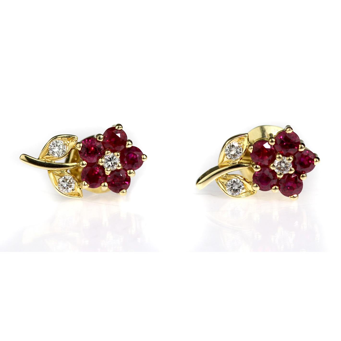 A pair of earrings set with round brilliant cut diamonds and round cut vivid red rubies. Set in 18 carat yellow gold with pin and push on butterfly fittings.
6 x round brilliant cut diamonds, approximate total weight 0.24 carats, assessed colour