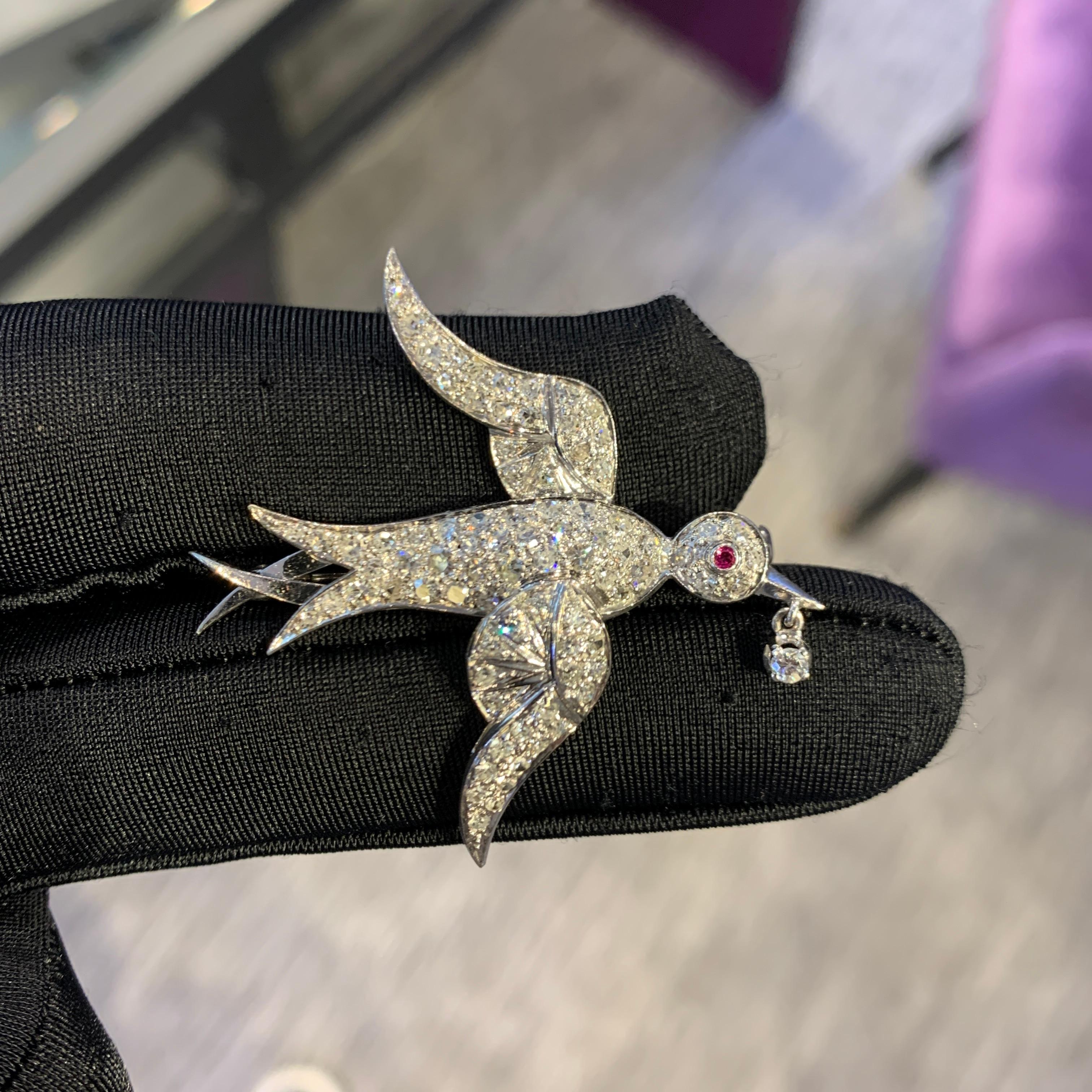 Diamond & Ruby Dove Brooch

A platinum brooch in the shape of a dove set with 84 round cut diamonds and a round cut ruby as its eye

Total Approximate Diamond Weight: 1.7 carats

Measurements: 1.75