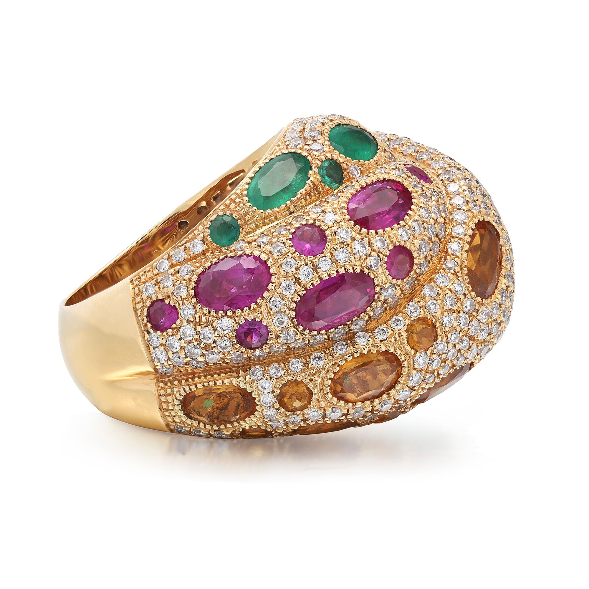 This stunning cocktail ring comes with a flashy statement look. A must have in your jewelry collection. The ring is crafted in 18K yellow gold. Showcases oval cut Ruby, Emerald and Citrine totaling 7.35 carats surrounded with pave set round