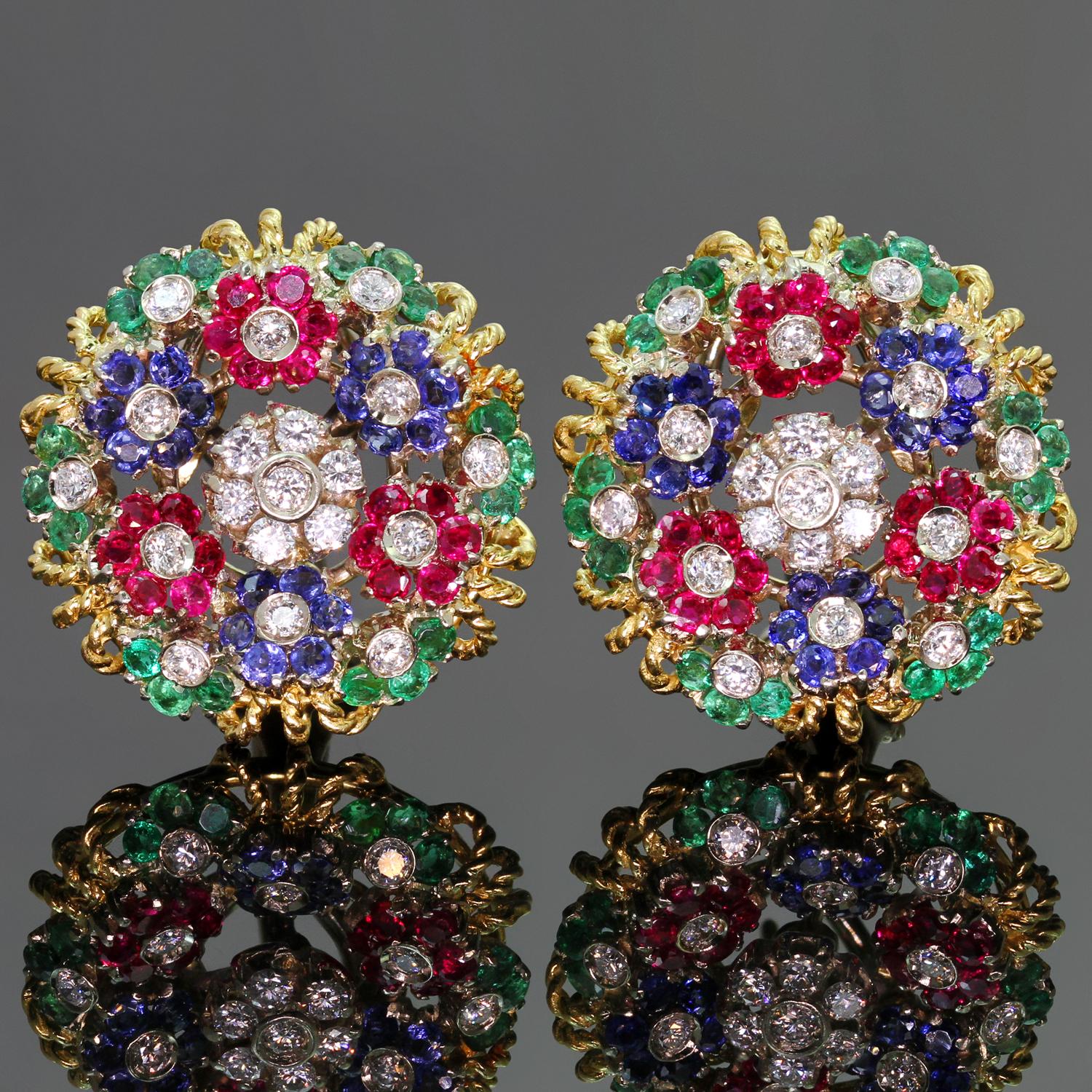 These stunningly vibrant lever-back round earrings are crafted by a fine Italian maker out of 18k yellow gold with white gold accents and beautifully accented with brilliant-cut diamonds, rubies, emeralds, and sapphires. The diamonds weigh an