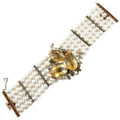 Bracelet en or rose et argent avec diamants, rubis, émeraudes, saphirs, topaze, perles