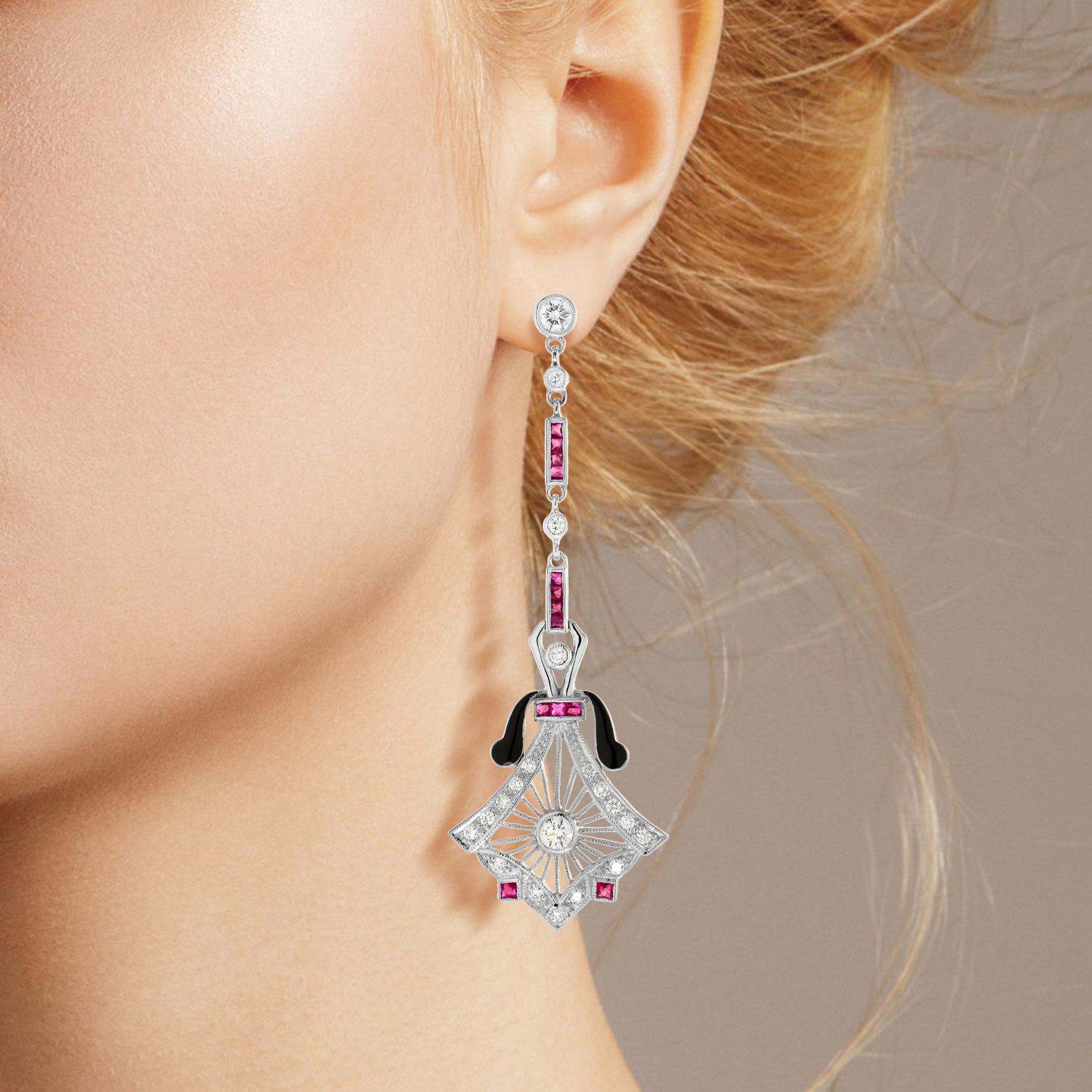 These antique dangle drop earrings are one of the most whimsical pieces of jewelry. When worn, the black enamel forms a beautiful contrast, which makes the diamonds and ruby stand out even more. Set in 14K white gold, these Art-Deco style earrings