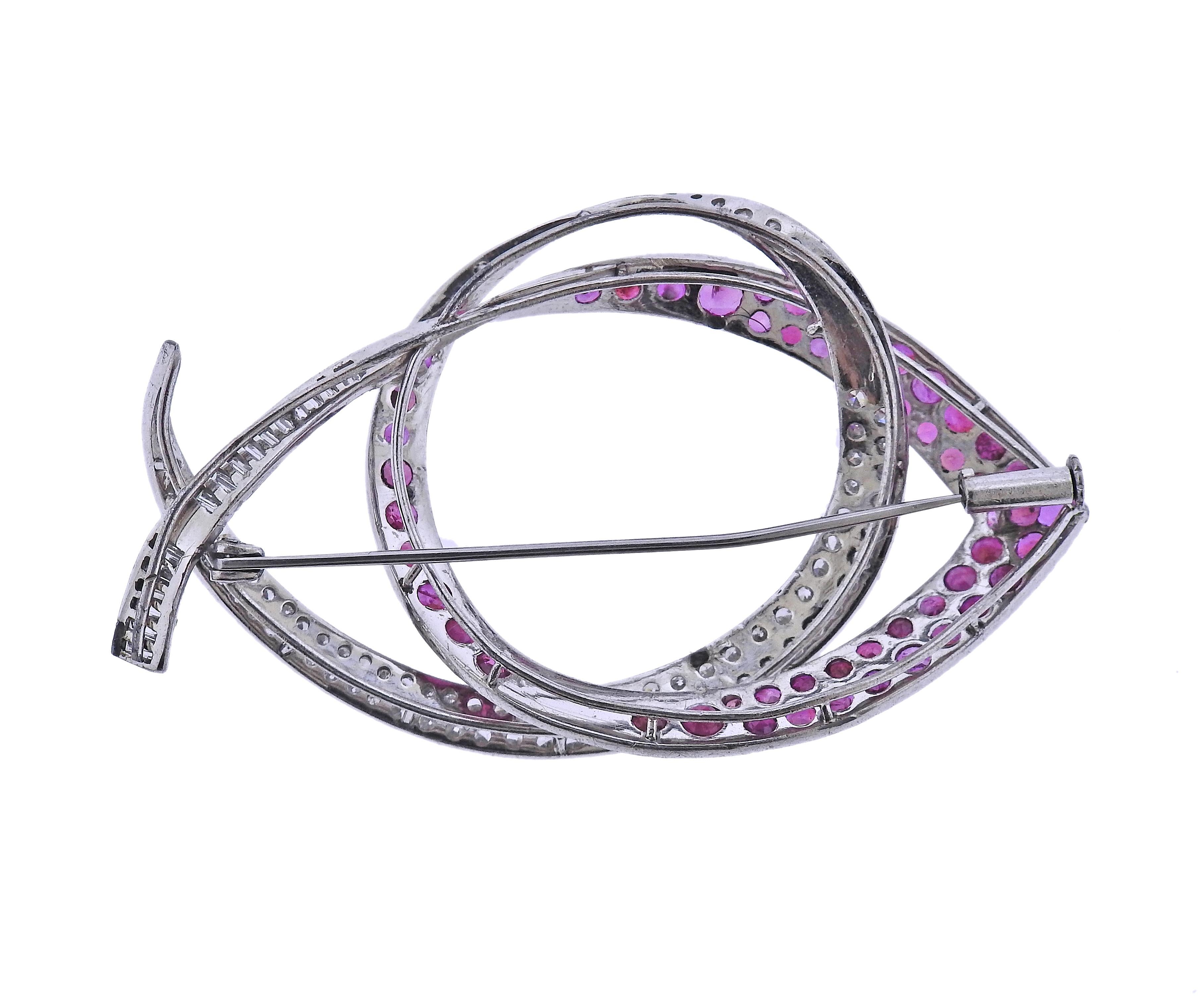 14k white gold fish motif brooch, with vibrant rubies and approx. 1.20ctw in diamonds.  Brooch measures 65mm x 40mm. Tested 14k. Weight - 15.8 grams. 