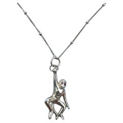 Collana con catena a scimmia in oro con diamanti e rubini