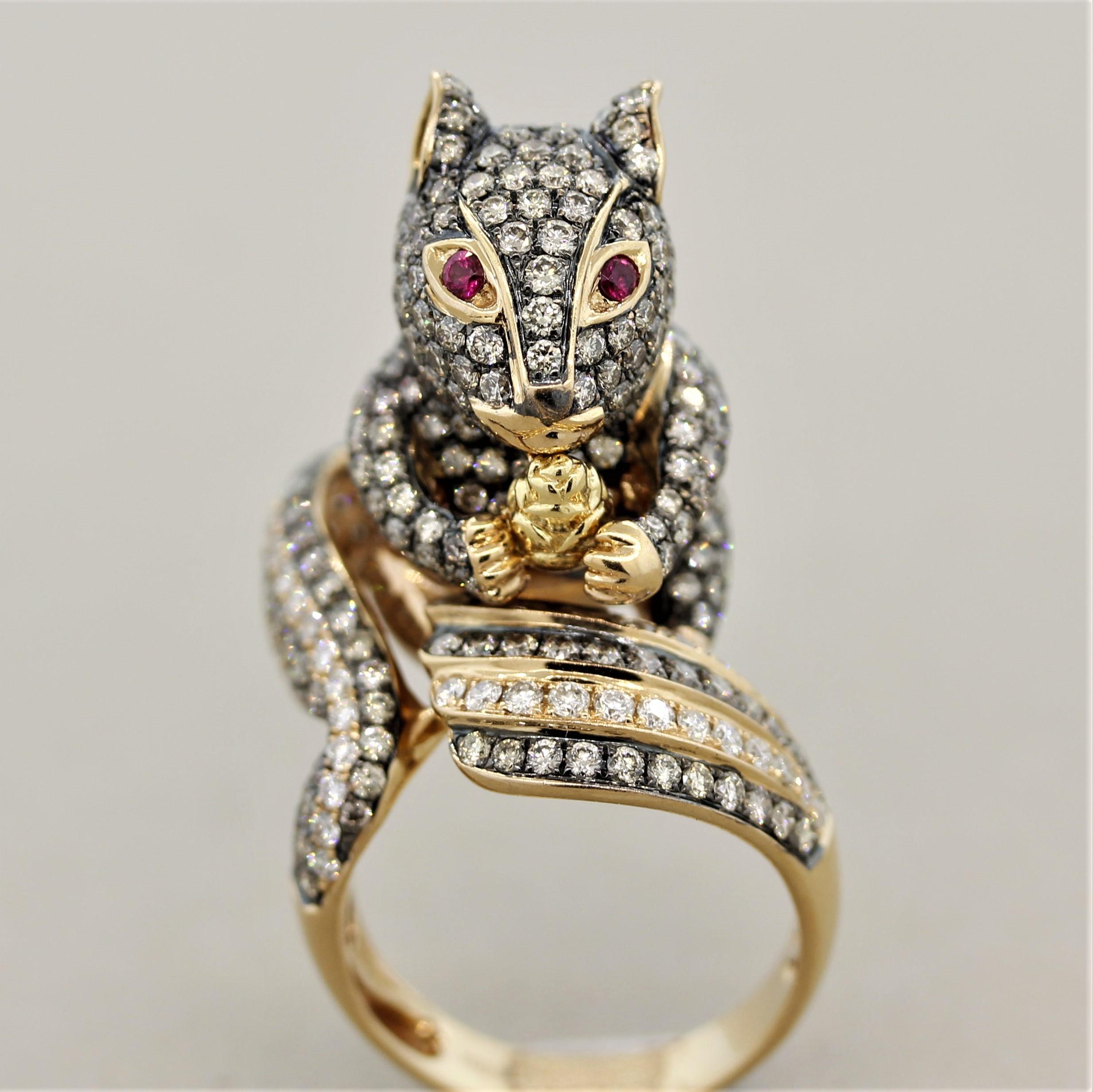 A sweet squirrel! This cute critter is studded in diamonds, 5.46 carats of round brilliant cut diamonds which are set across its body and tail. Two round shaped rubies are used as its eyes. The ring is made in 18k rose gold with rhodium accents