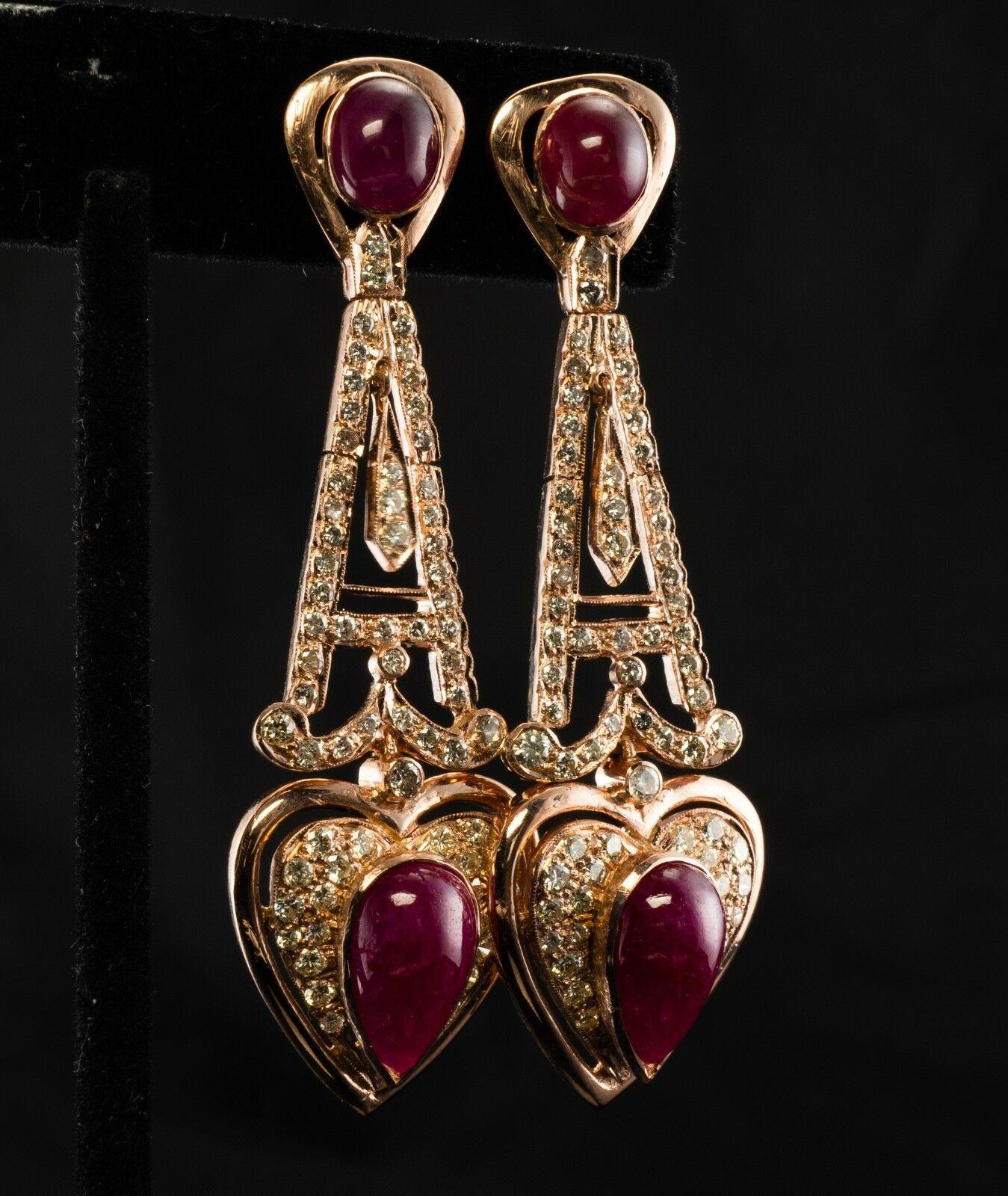 This amazing estate pair of earrings is finely crafted in solid 18K Rose Gold (carefully tested and guaranteed) and set with genuine Earth mined Rubies and Diamonds. The top cabochon Ruby measures 7mm x 6mm (1.59 carat), the Ruby on the bottom is