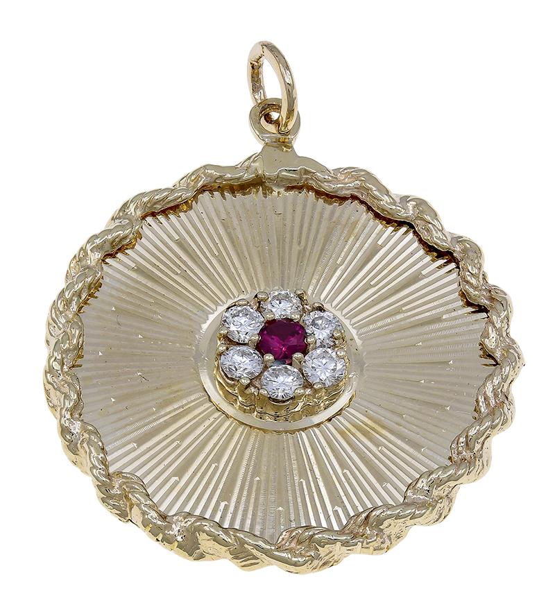 Fabulous statement charm:  A very large round charm/pendant.  Set in the center with brilliant diamonds and a bright faceted ruby.  Radiating line pattern with an applied rope border.  On the back, engraved in French, is 