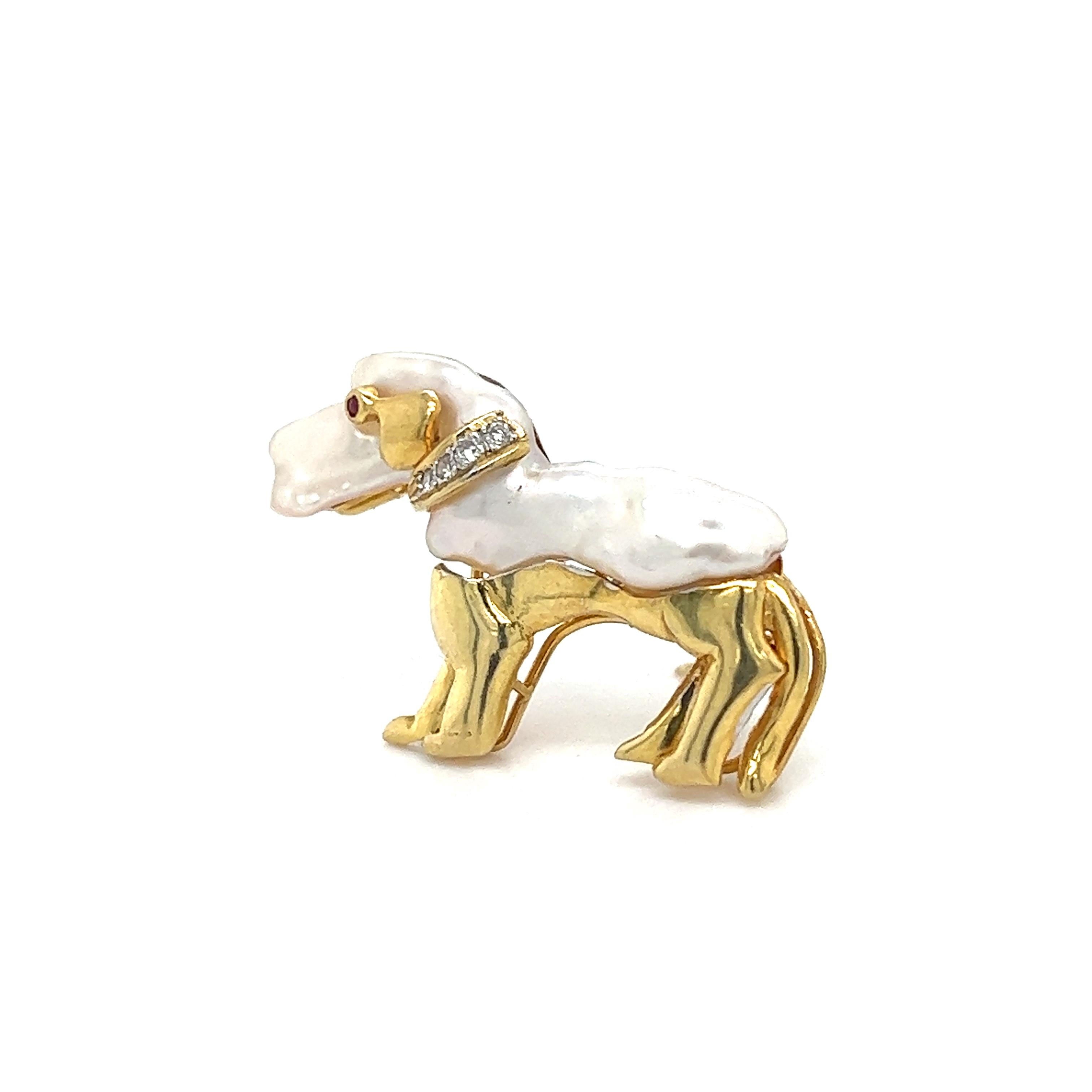 Details are endless on this one of a kind Dachshund brooch/pendant. The piece is crafted in 14k yellow gold and perfectly depicts this lovable dog breed. The body and head section of the dog is set with a natural Keshi pearl. A pop of scintillation