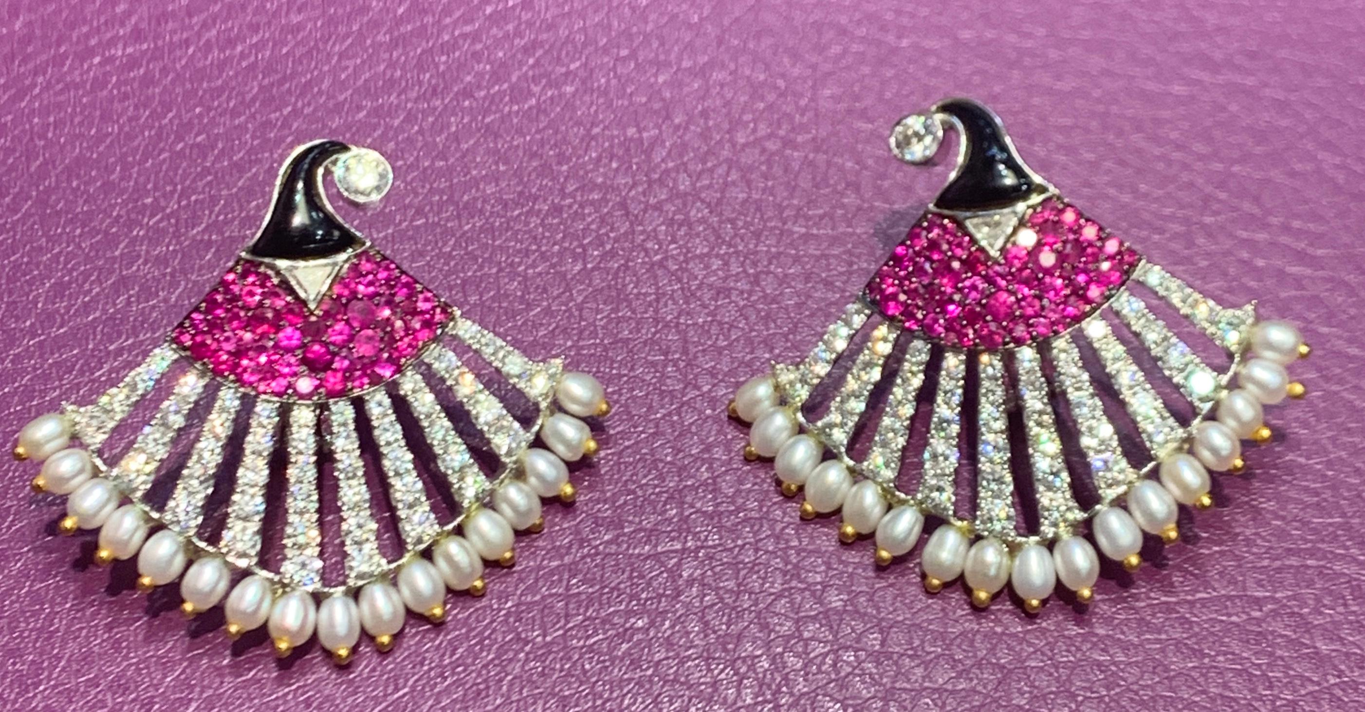 Diamond Ruby & Pearl Egyptian Revival Earrings  set in 18K White Gold 
Diamond Weight: 3.28 Cts 
Ruby Weight: 2.16 Cts 
Pearl weight: 7.75 Cts 
Back Type: Clip on with post
Measurements: 1