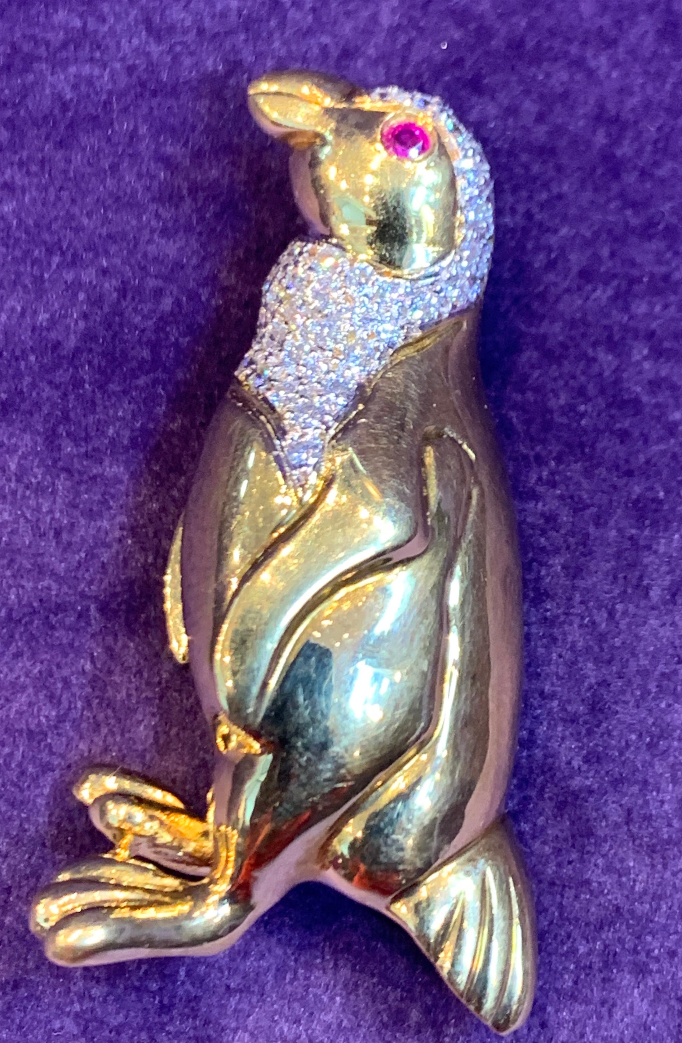 Diamond & Ruby Penguin Brooch
Made by elan 1980's
18K Yellow Gold
Diamond Weight: .78 Cts
18.5 Grams