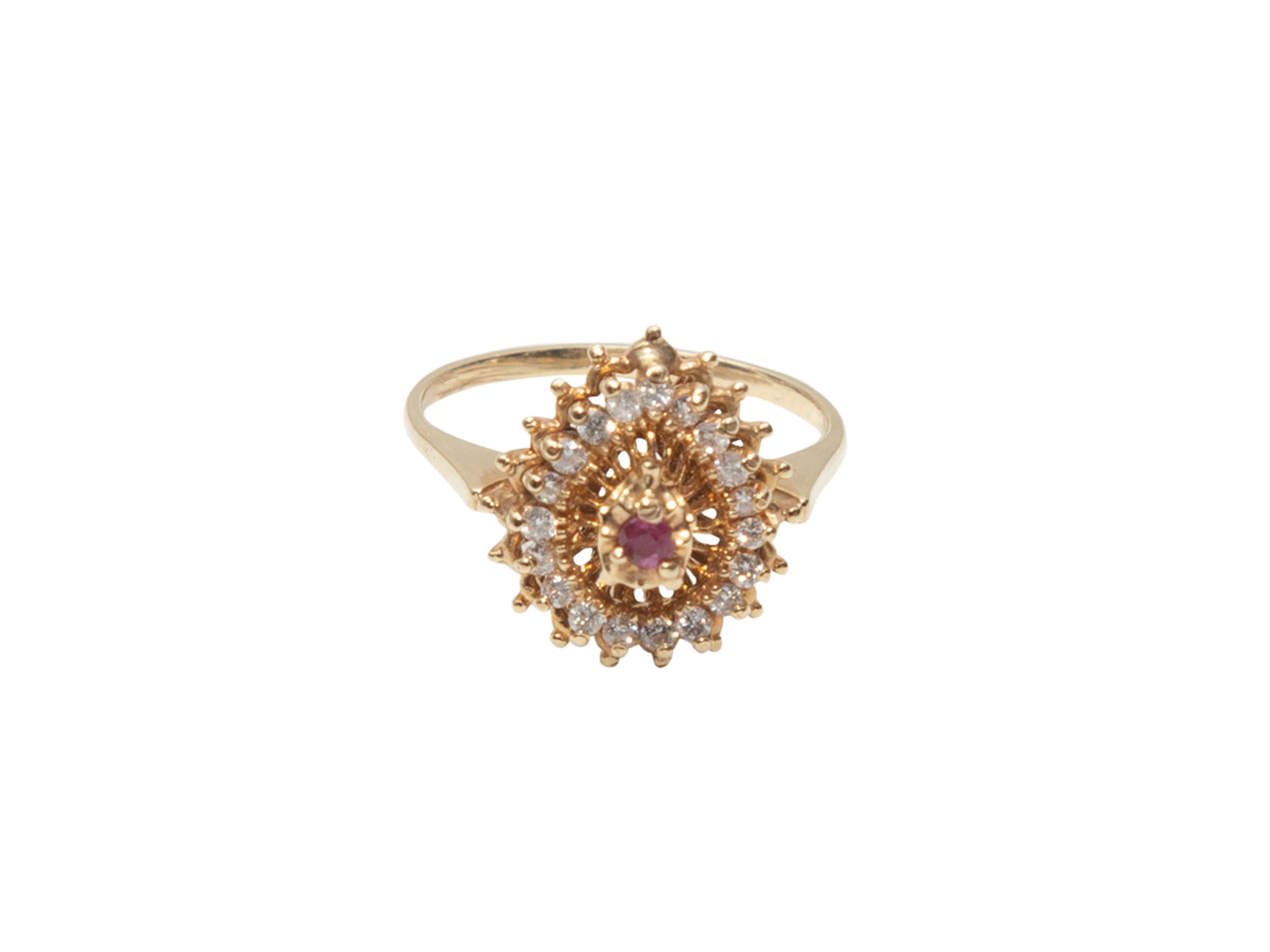 Product details: 14K gold, diamond, and ruby cluster pinky ring. 0.5