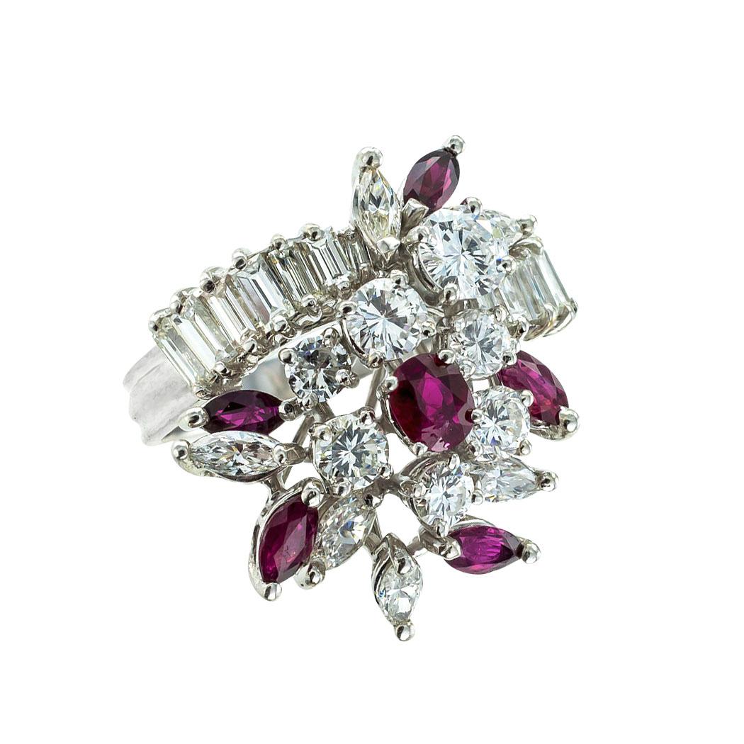 Diamond and ruby platinum cluster cocktail ring circa 1960. *

ABOUT THIS ITEM:  #R-DJ28C. Scroll down for detailed specifications.  This assemblage of varying diamond shapes highlighted by randomly set rubies is a tour de force in unabashed bling,