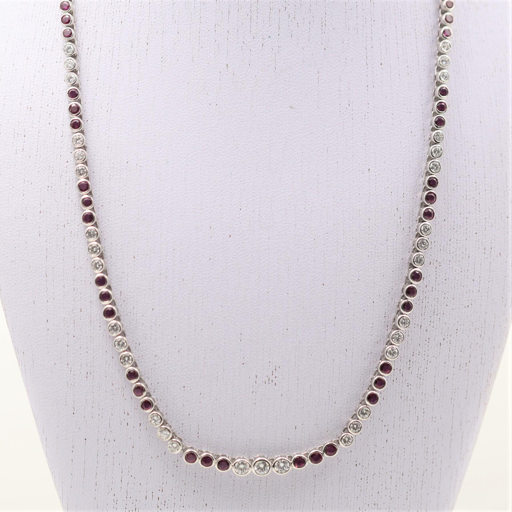 A lovely platinum made necklace featuring 3.87 carats of bright white diamonds and 6.19 carats of vivid red rubies. The stones are all round shapes and bezel set one after the other in rows of three. The center of the necklace with the 3 largest
