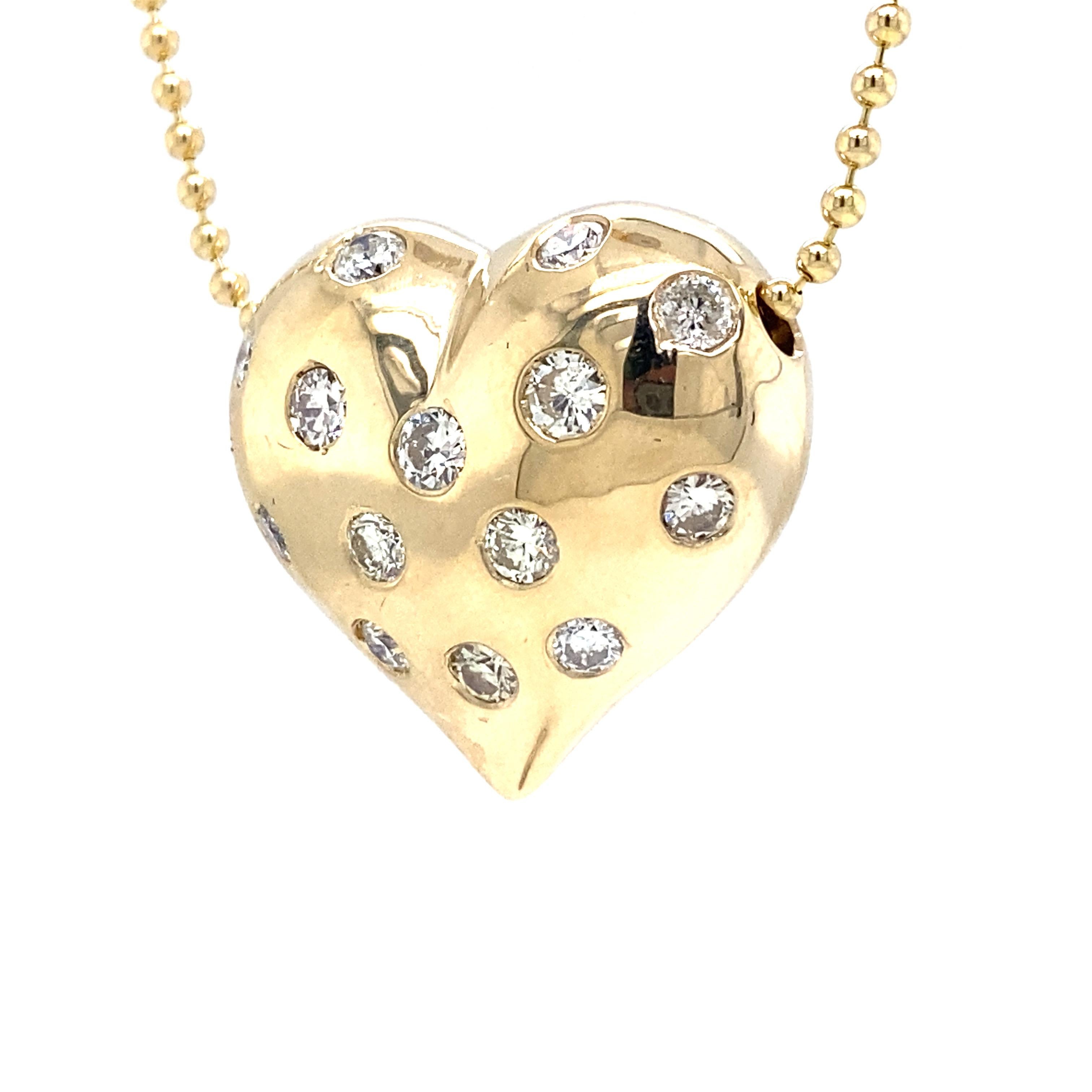 Diamond Ruby Puff Heart Pendant Necklace in 12K and 14K Yellow Gold.  Rubies weighing 1.03 carats and Round Brilliant Cut Diamonds weighing 1.26 carat total weight, G-H in color and VS-SI in clarity are expertly Bezel set.  The Necklace measures 16