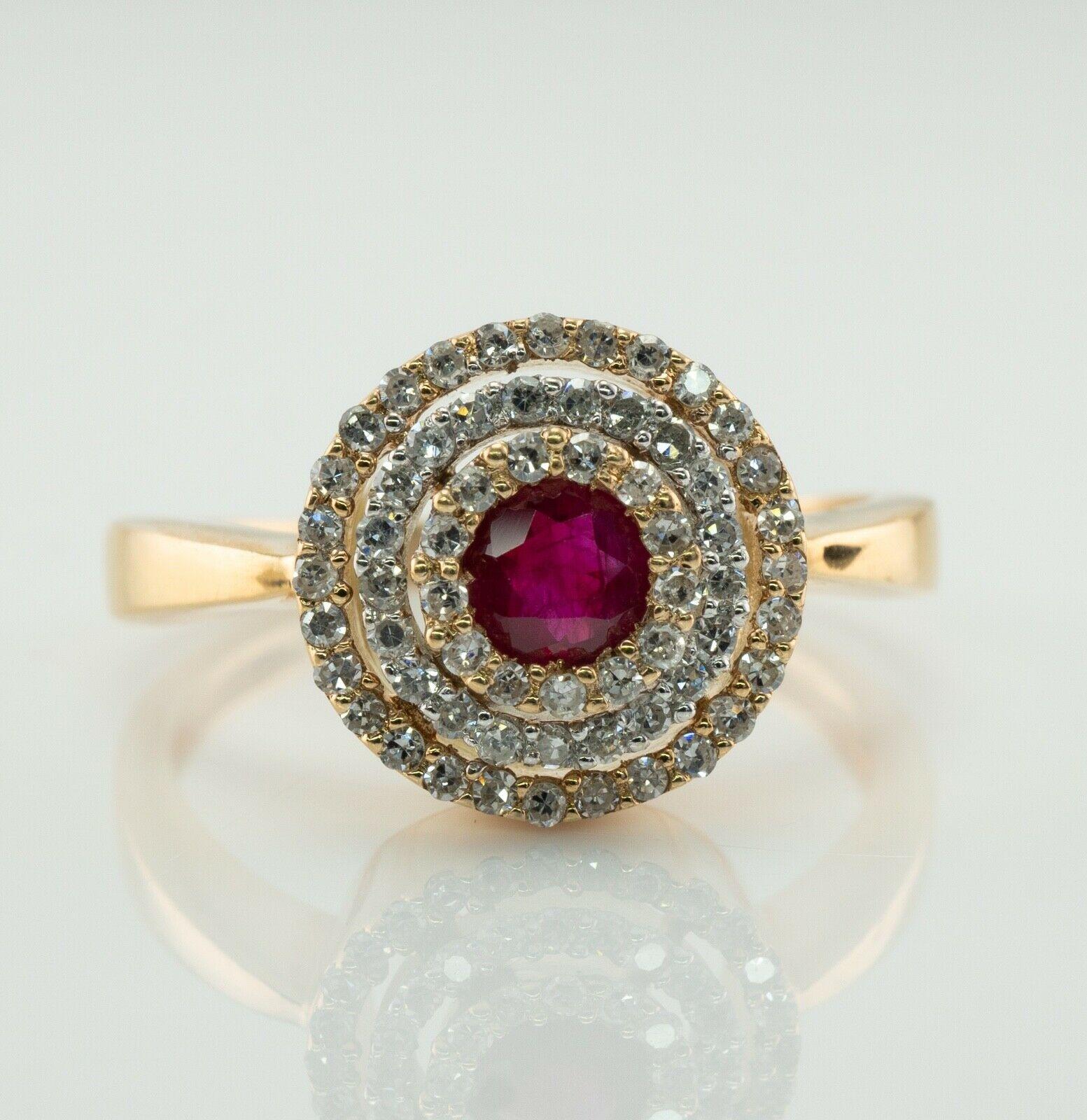 This absolutely stunning estate ring is finely crafted in solid 14K Yellow gold and set with Natural Earth-mined Ruby and diamonds. The center red Ruby measures 3.5mm (.22 carat) and this is a very clean and transparent gem of great intensity and