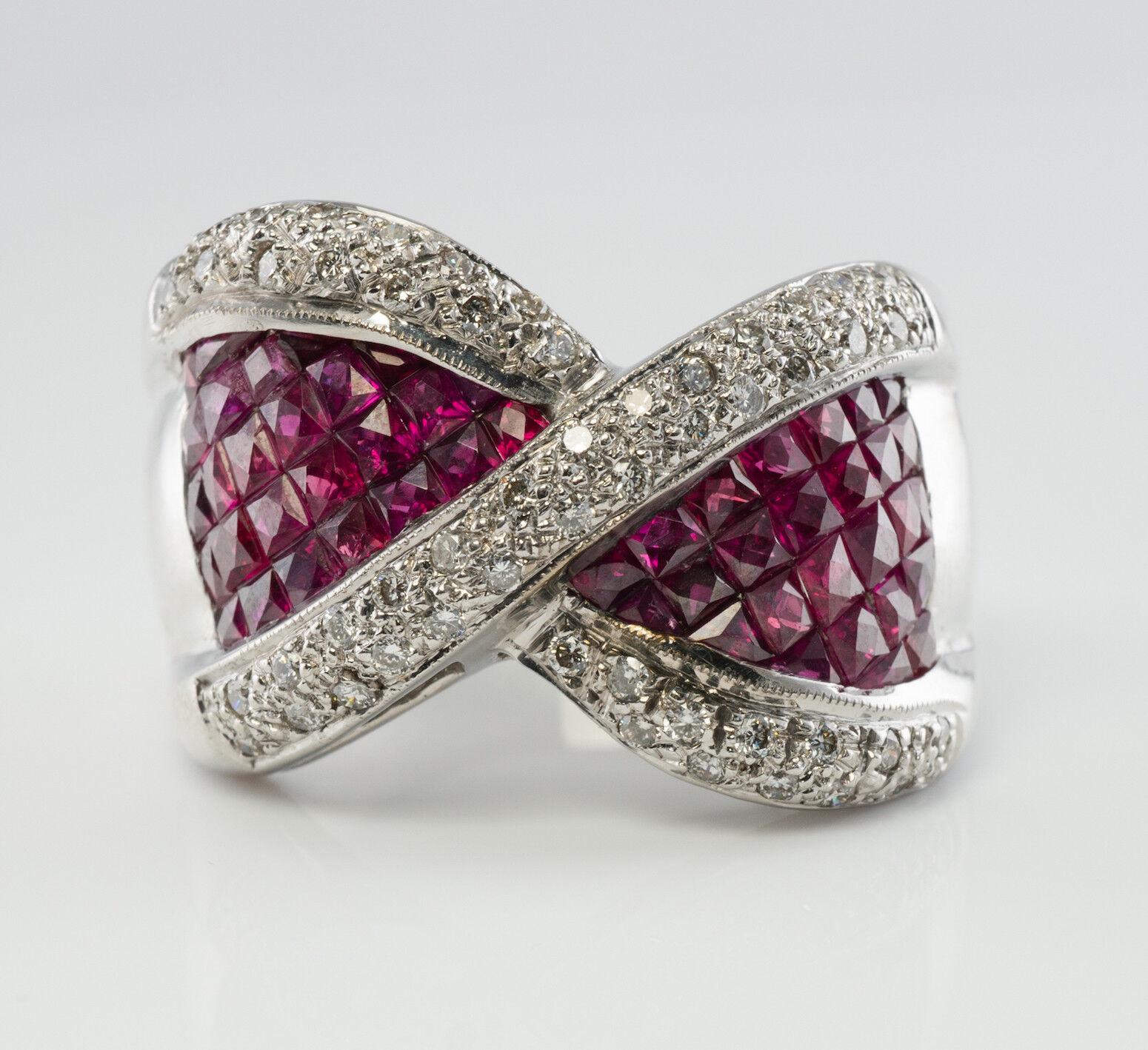 This high-end estate ring is finely crafted in solid 18K White gold and set with the highest quality Earth-mined French-cut Rubies and Diamonds. There are 26 French cut Rubies on each side of the pretty bow. These Rubies are very clean and
