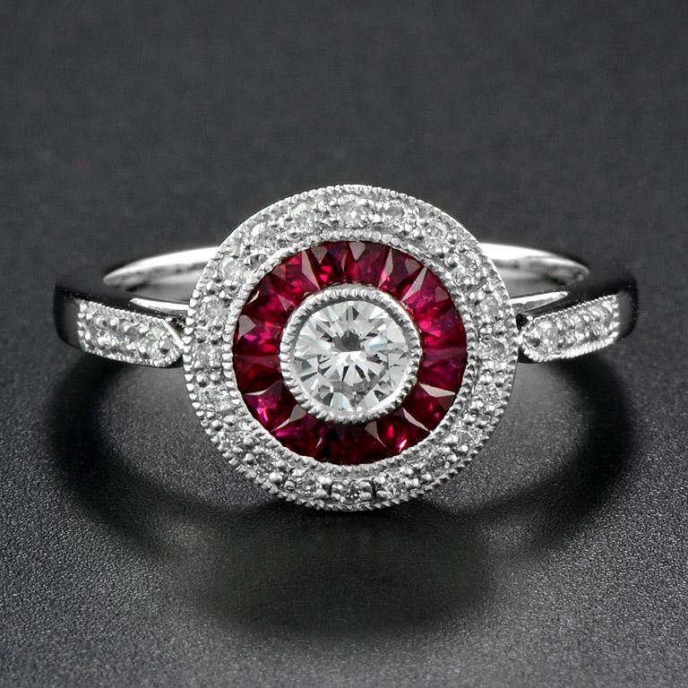 This Art-Deco style engagement ring is completely spectacular! The vibrant color stone (you can select Blue Sapphire, Emerald, Ruby) is a specialty cut to surround the excellent round brilliant cut center diamond, which is in a thin bezel with