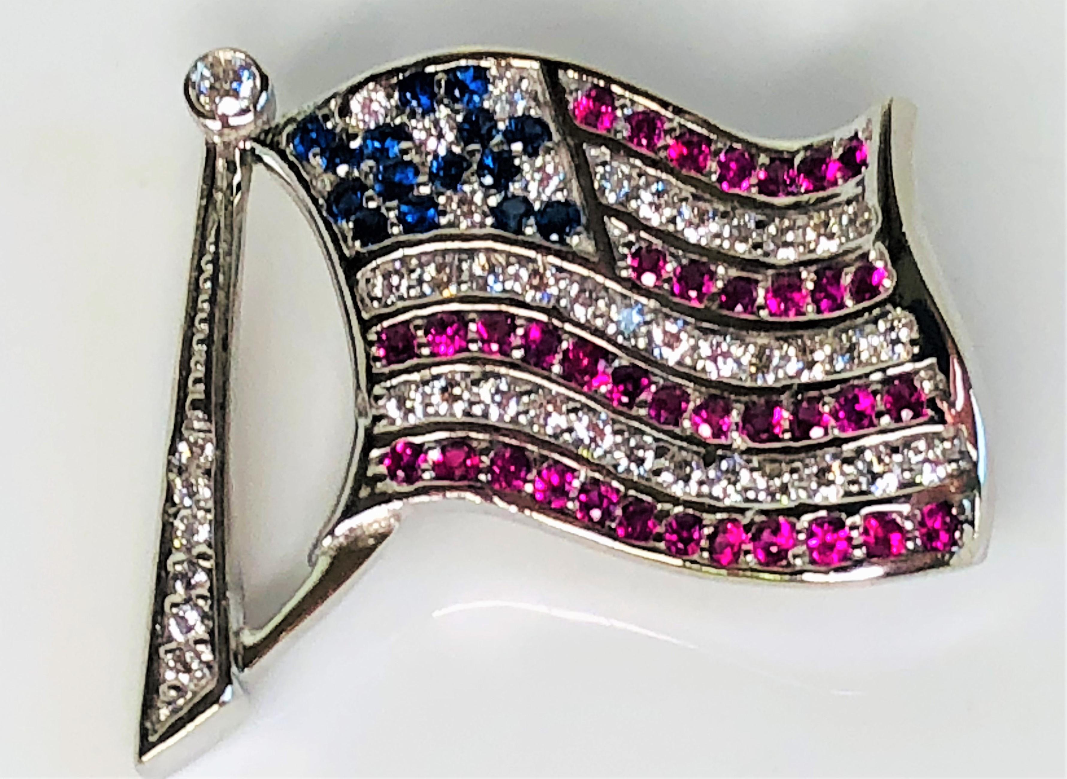 This American Flag pendant really sparkles!  
.47 total carat weight (tcw) sapphire, .38 tcw, ruby, and .60 tcw diamond.
2 loops on back are approximately 7mm wide to accommodate many different necklaces.
Can be worn has a pendant on a chain or a