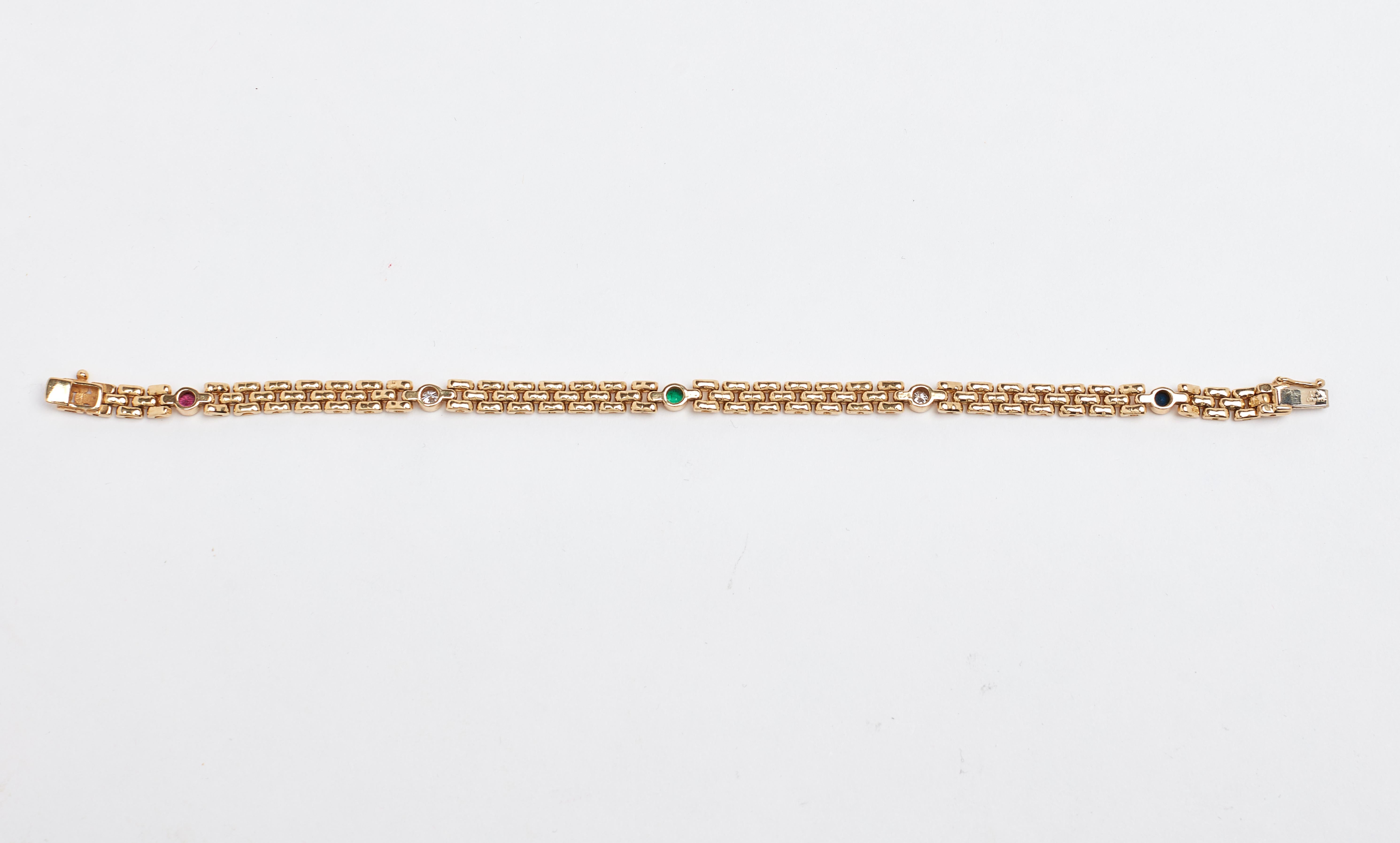 14k yellow gold channel set Diamond Ruby Sapphire and Emerald bracelet. Total weight for all stones is approximately 1 carat total. 7.50 inches long