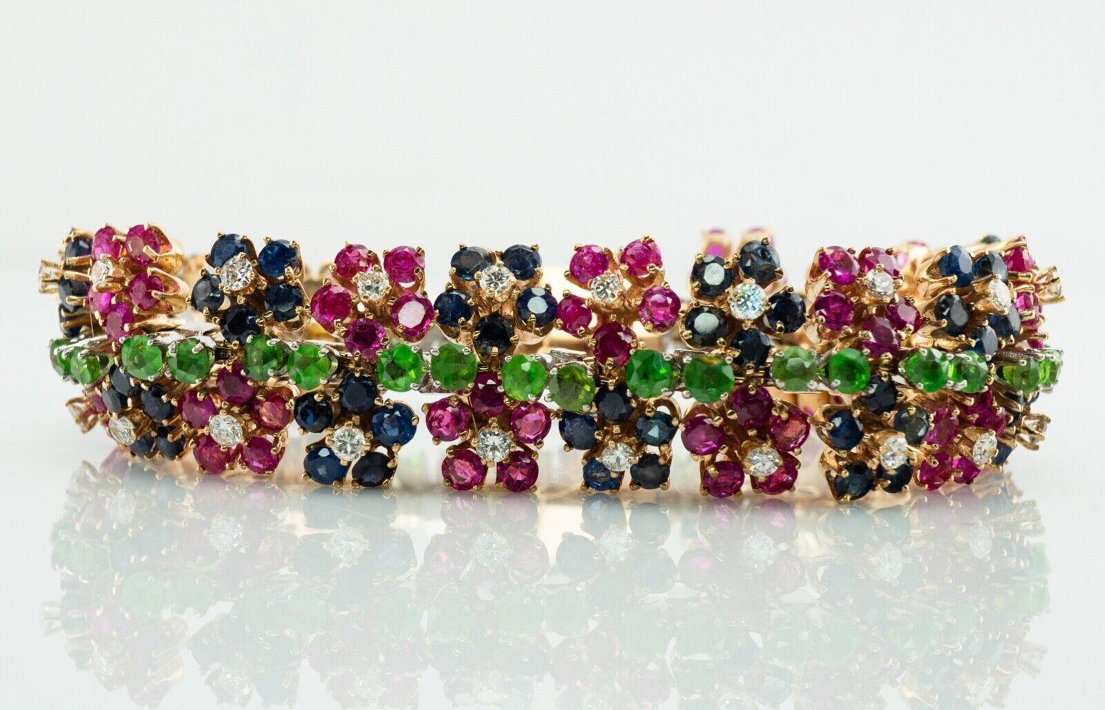 This gorgeous vintage bracelet is finely crafted in solid 14K Yellow Gold (stamped and carefully tested and guaranteed). 
It is set with natural Earth mined gemstones arranged in flower theme: Rubies, Sapphires, Peridots, and Diamonds. 
There are 19
