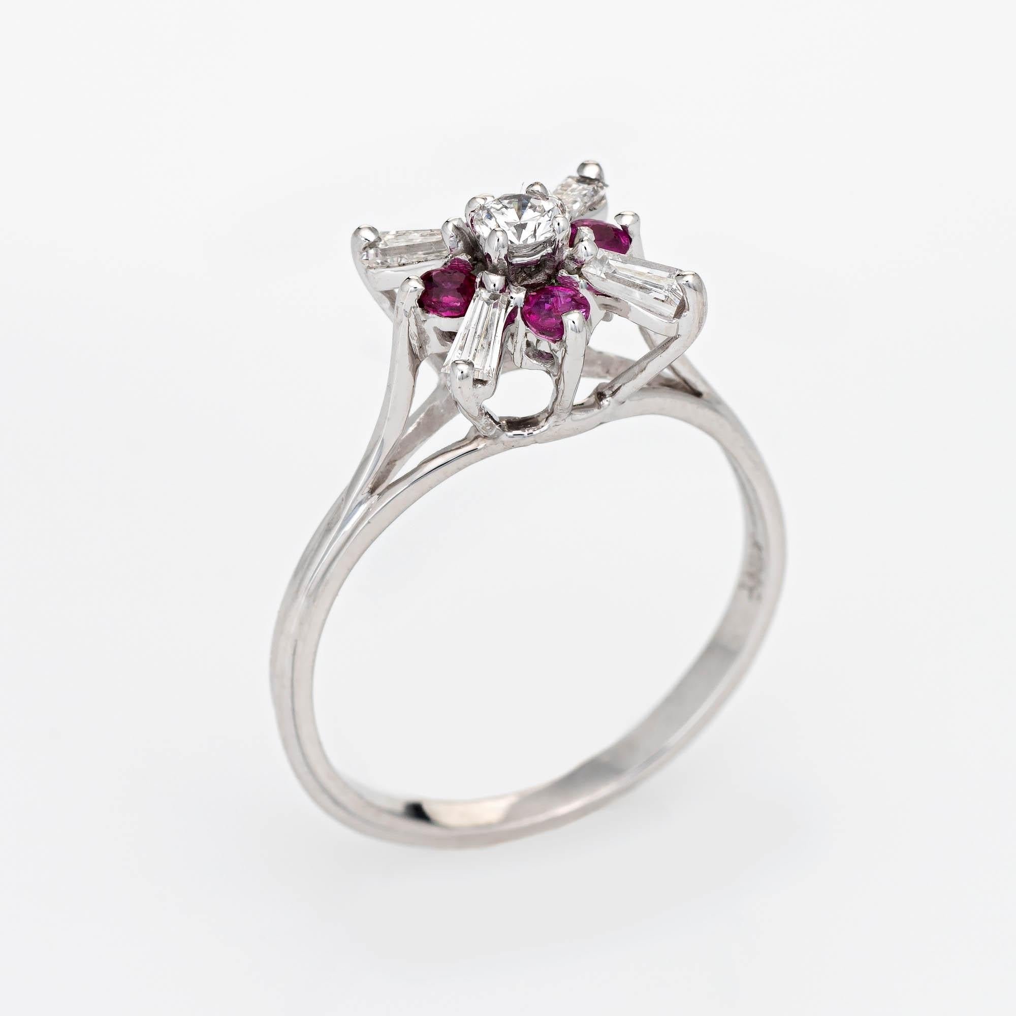 Stylish vintage diamond & ruby cocktail ring crafted in 18 karat white gold. 

Tapered baguette cut diamonds and one round brilliant cut diamond total an estimated 0.66 carats (estimated at G-H color and VS2-SI1 clarity). Four estimated 0.03 carat
