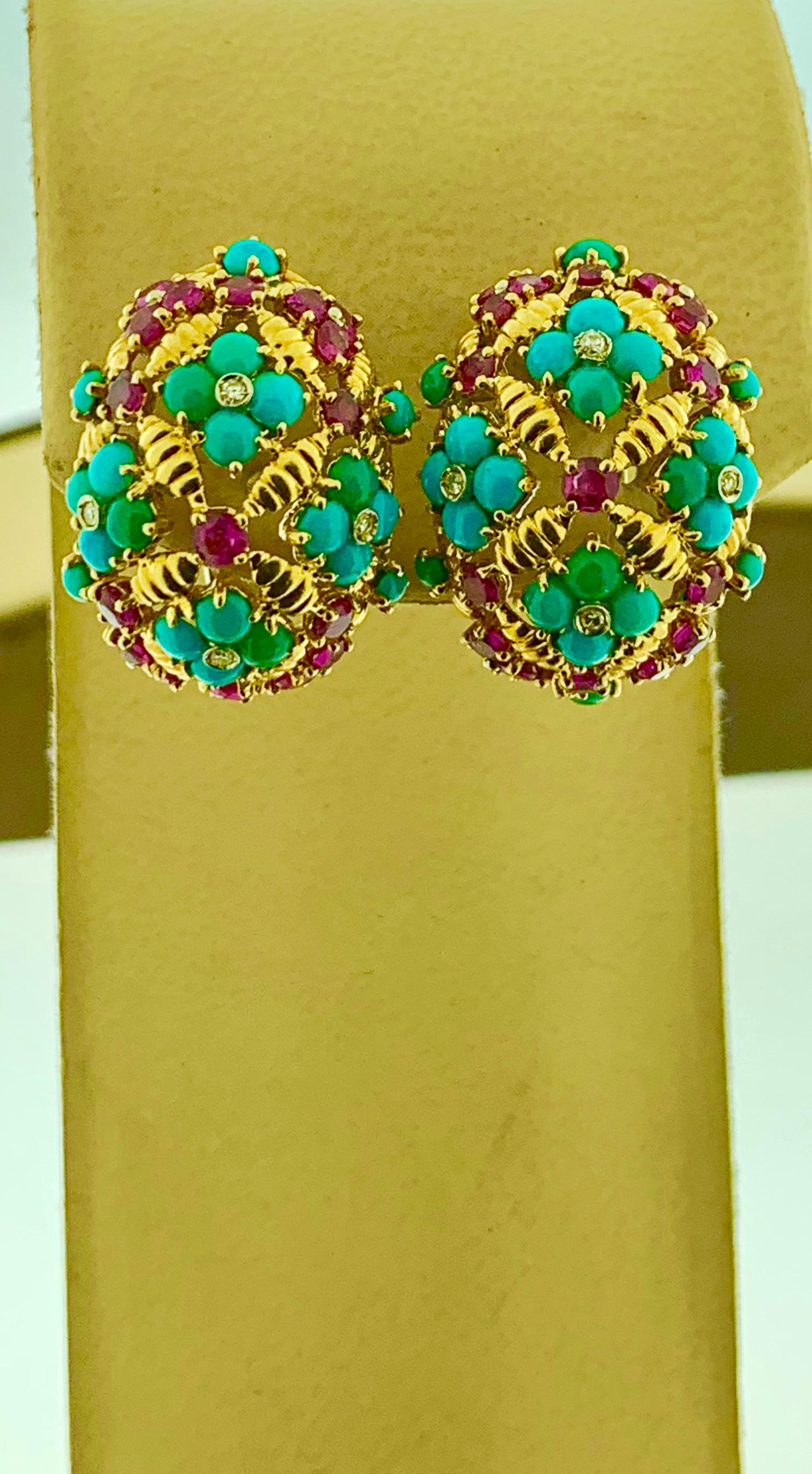 
Diamond Ruby & Turquoise  Clip Earrings In 18 Karat Yellow Gold 17 Grams
This exquisite pair of earrings are beautifully crafted with 18 karat  Yellow gold .
Weight of 18 K gold 17.10 grams, earrings are stamped for 18 K 
 Fine  Round Cut Ruby