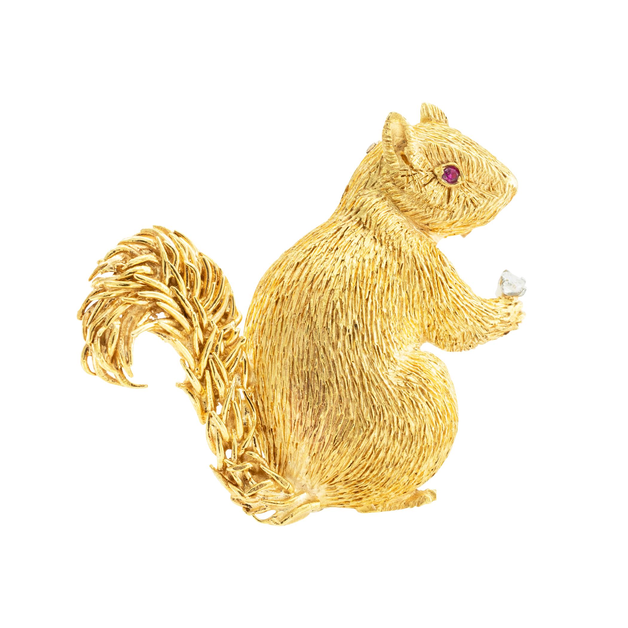 Diamond and ruby yellow gold squirrel clip brooch circa 1970. *

ABOUT THIS ITEM:  #P-DJ310J.  Scroll down for detailed specifications. The movements and stance of the squirrel have been beautifully captured by the artist resulting in a realistic