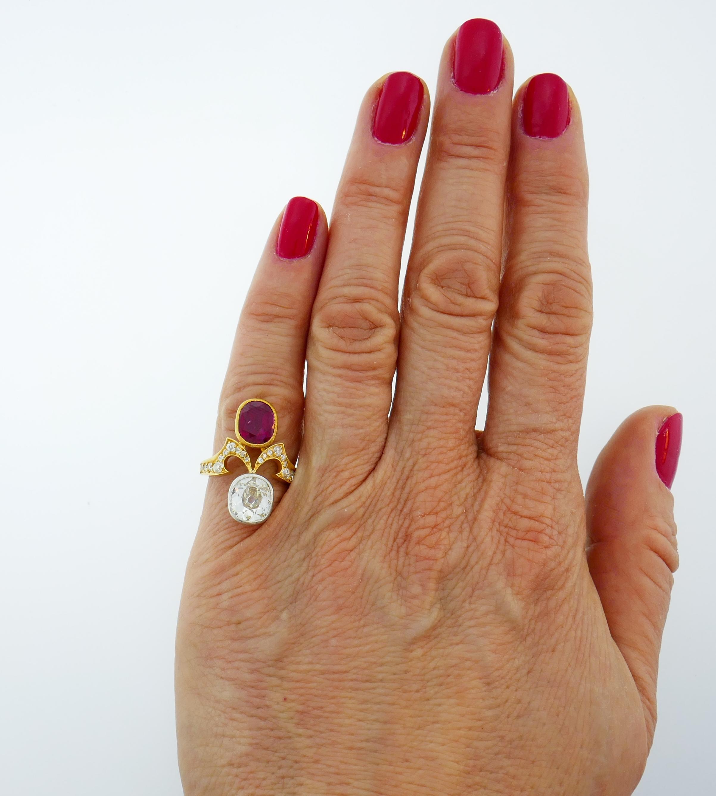 Classic Toi et Moi Victorian ring. Elegant, timeless, feminine and wearable, the ring is a great addition to your jewelry collection.
Made of 18 karat yellow gold (stamped and tested), the ring features a hand-faceted old cushion cut ruby and