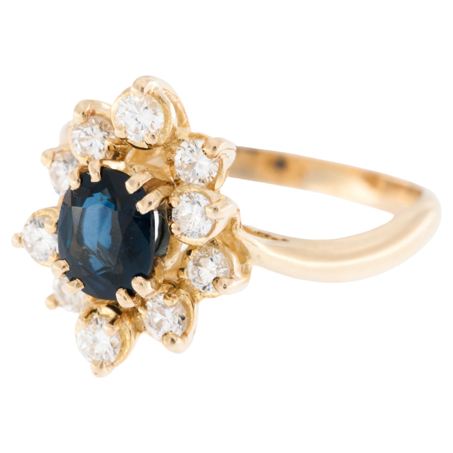 Anillo francés de oro amarillo de 18 quilates con diamantes y zafiro