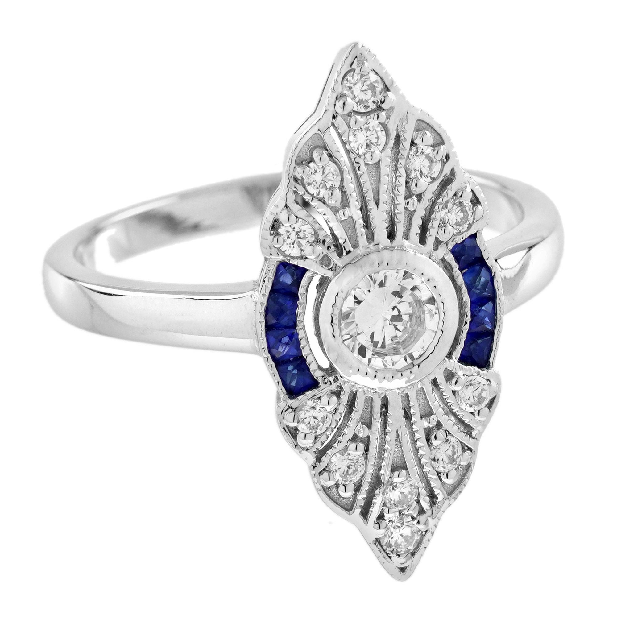A brilliant round diamond at the center, flanked by vibrant French cut sapphires on the left and right. The design is further enhanced by additional diamonds, all framed in a bold marquise shape. The striking contrast of the diamonds and sapphires,