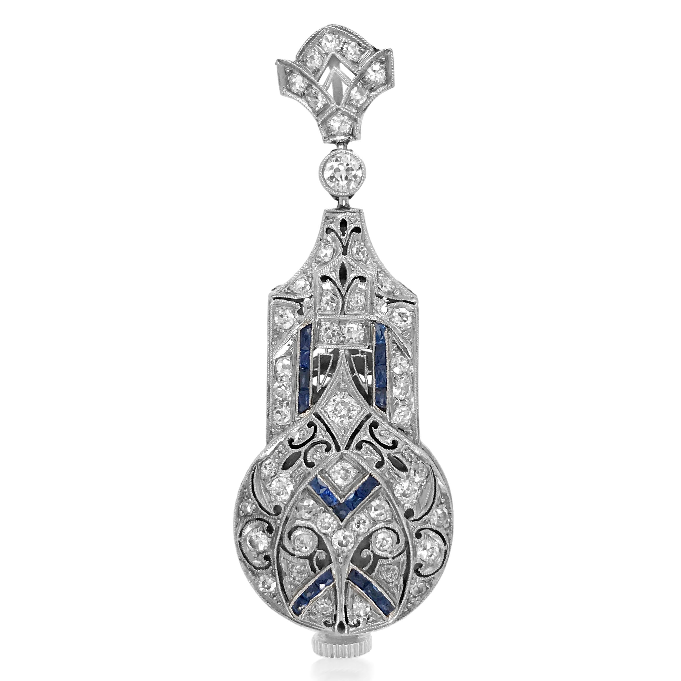 This enchanting, meticulously made diamond and sapphire pendant watch is an elegant choice for all occasions, handcrafted in solid platinum, weighs 14.92 grams and measures 55x24 mm. The front is adorned with approx. 1.0ct old-European cut diamonds
