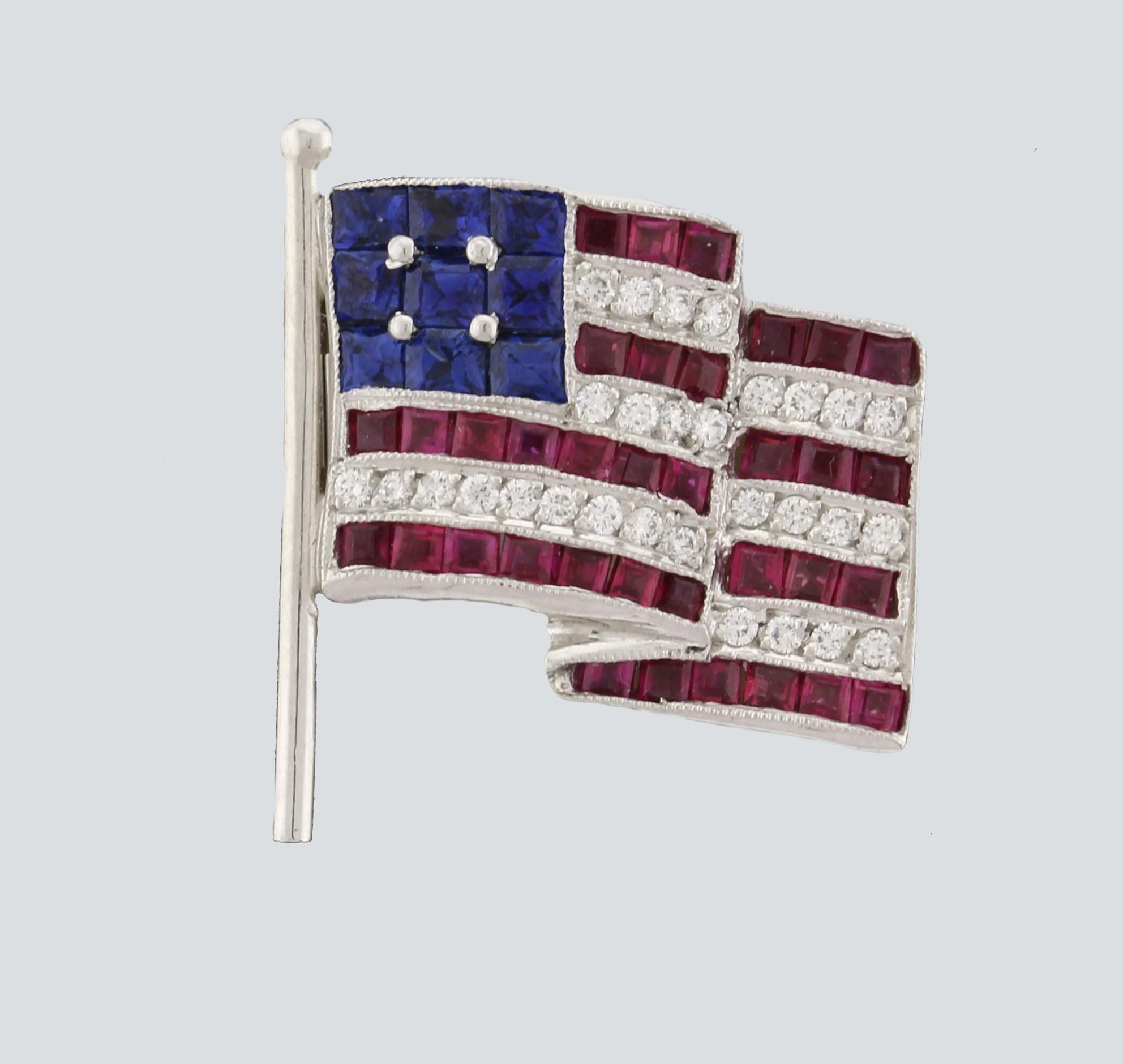 From Felix Vollman, an American Flag lapel pin/brooch, The platinum pin was made from the original 1930's mold and retailed by Pampillonia in Washington DC. The pin/brooch is 7/8th of an inch high and ¾ on an inch wide. Set with calibrated fine