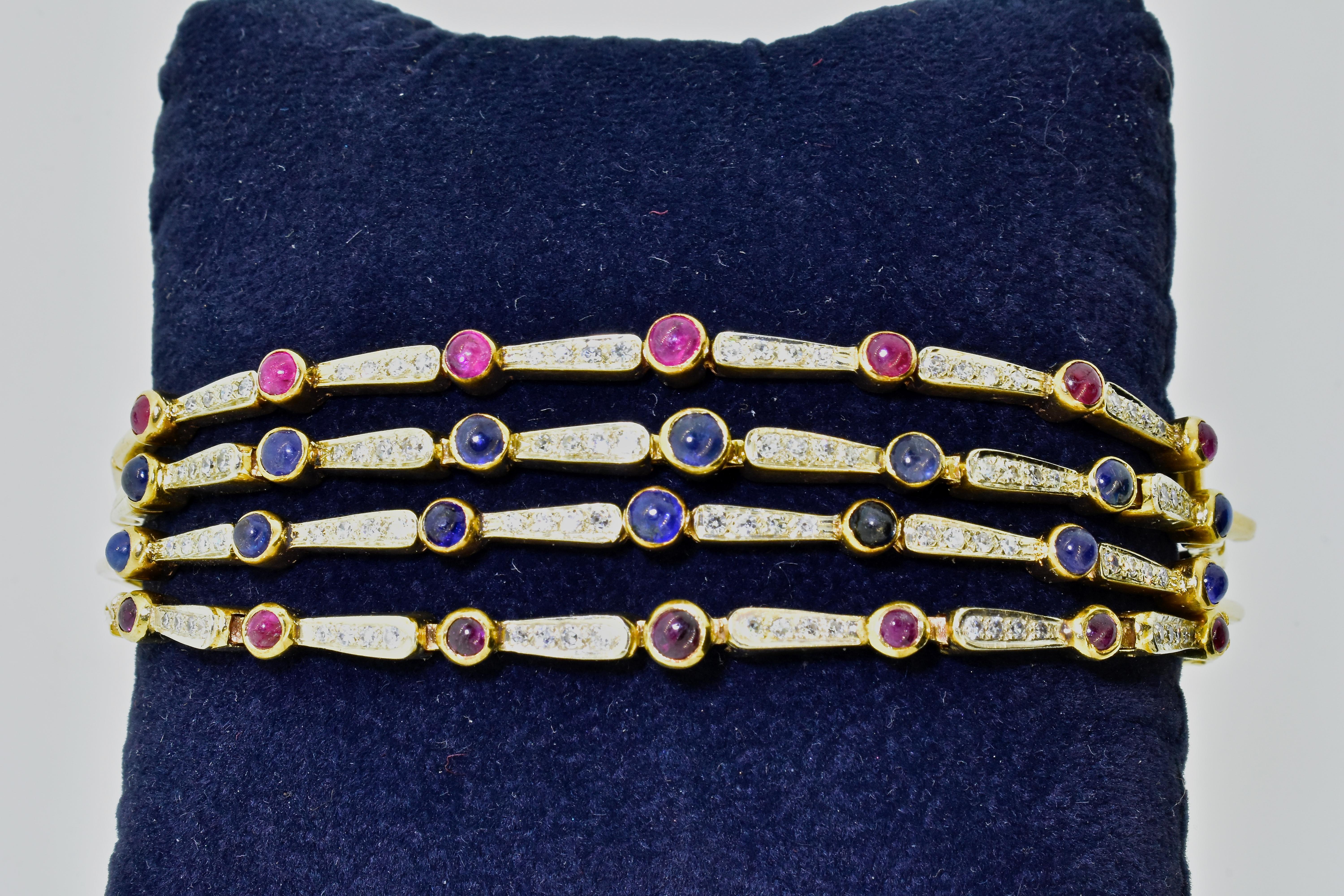 Sapphire, ruby and diamond flexible gold bracelet  with 14 natural fine blue sapphires and 14 natural fine bright red rubies, cut en cabochon.  There are 1.6 cts of rubies and 1.6 cts. of sapphires.  These colored stones are well matched in color