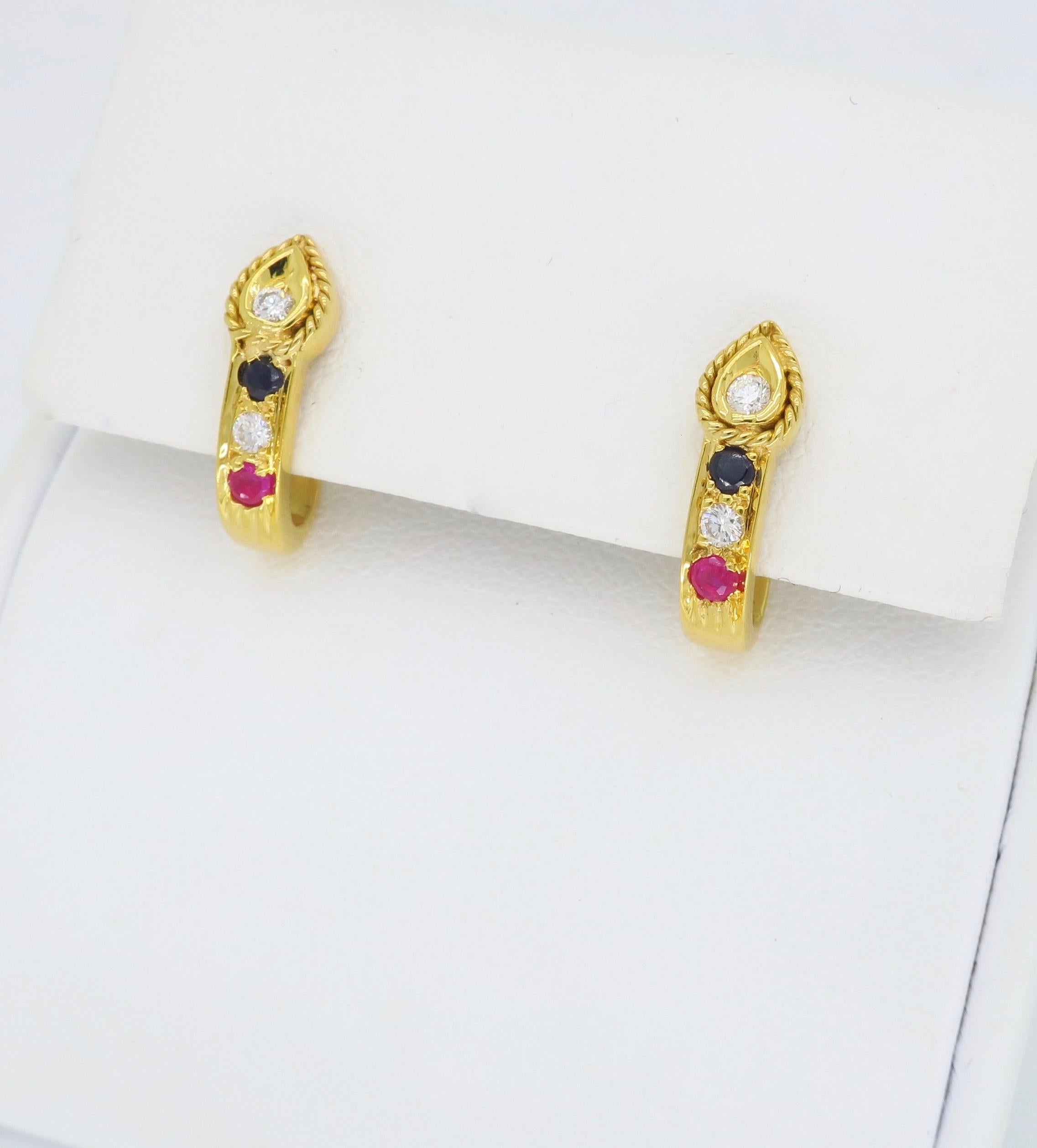 Unique screw back style Diamond, Blue Sapphire and Ruby earrings crafted in 21K yellow gold.

Gemstone:  Diamond, Blue Sapphire and Ruby
Gemstone Carat Weight: 2 Approximately 1.8mm Round Blue Sapphires, 2 Approximately 1.8mm Round Rubies
Diamond