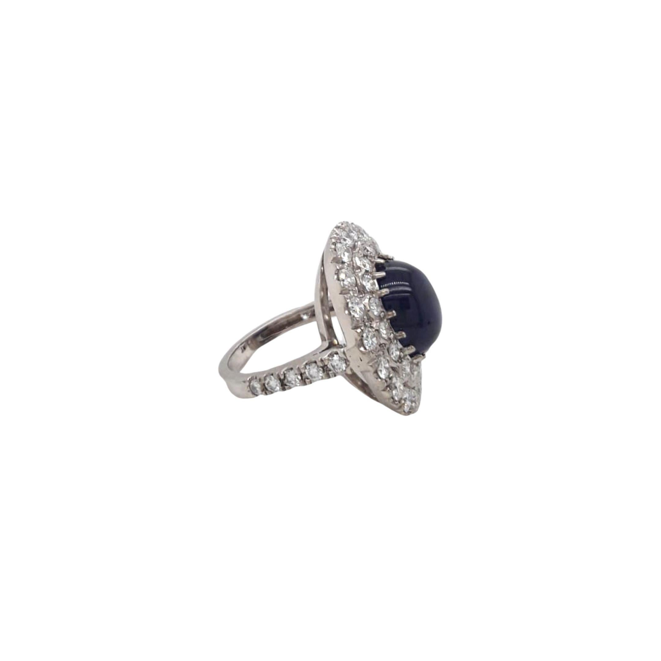 Antique Style Diamond and Cabouchon Sapphire Ring made with natural sapphires and brilliant cut diamonds. Sapphire Quantity: 1 oval sapphire, Sapphire Weight: 6.70 carats. Diamond Quantity: 45 round diamonds (0.03-0.05pts), Diamond Total Weight: