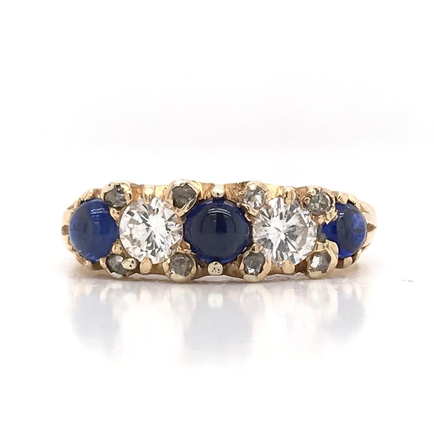 This piece was crafted sometime during the Retro design period ( 1940-1960 ). The setting is 18k gold and features 0.50 carats of sparkling diamonds as well as three deep blue cabochon cut sapphires. This mid-century piece features a few interesting