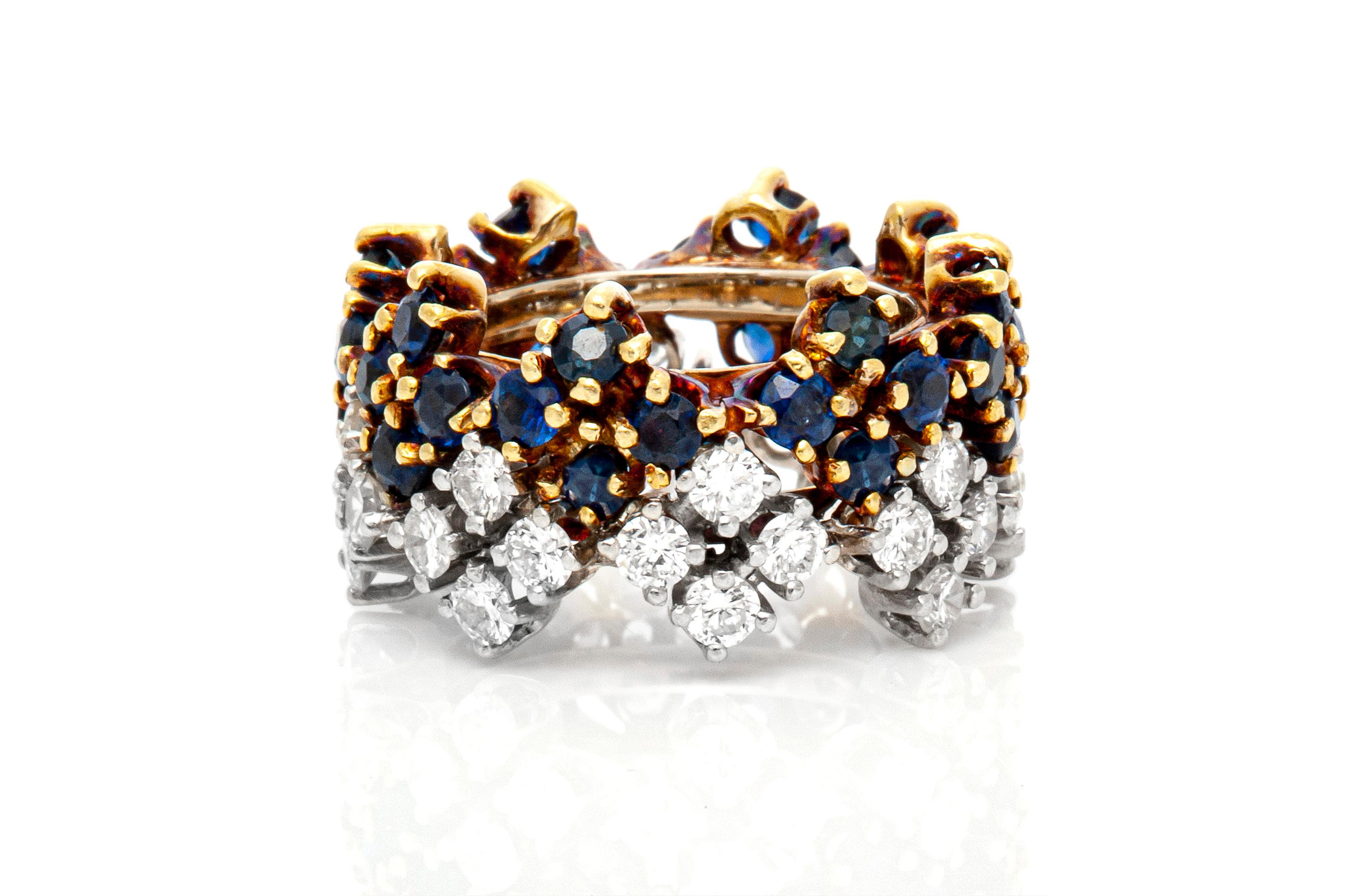 Band, finely crafted in 18k yellow and white gold with diamonds weighing approximately a total of 2.30 carat and sapphires weighing approximately a total of 3.00 carat. Circa 1980's.
