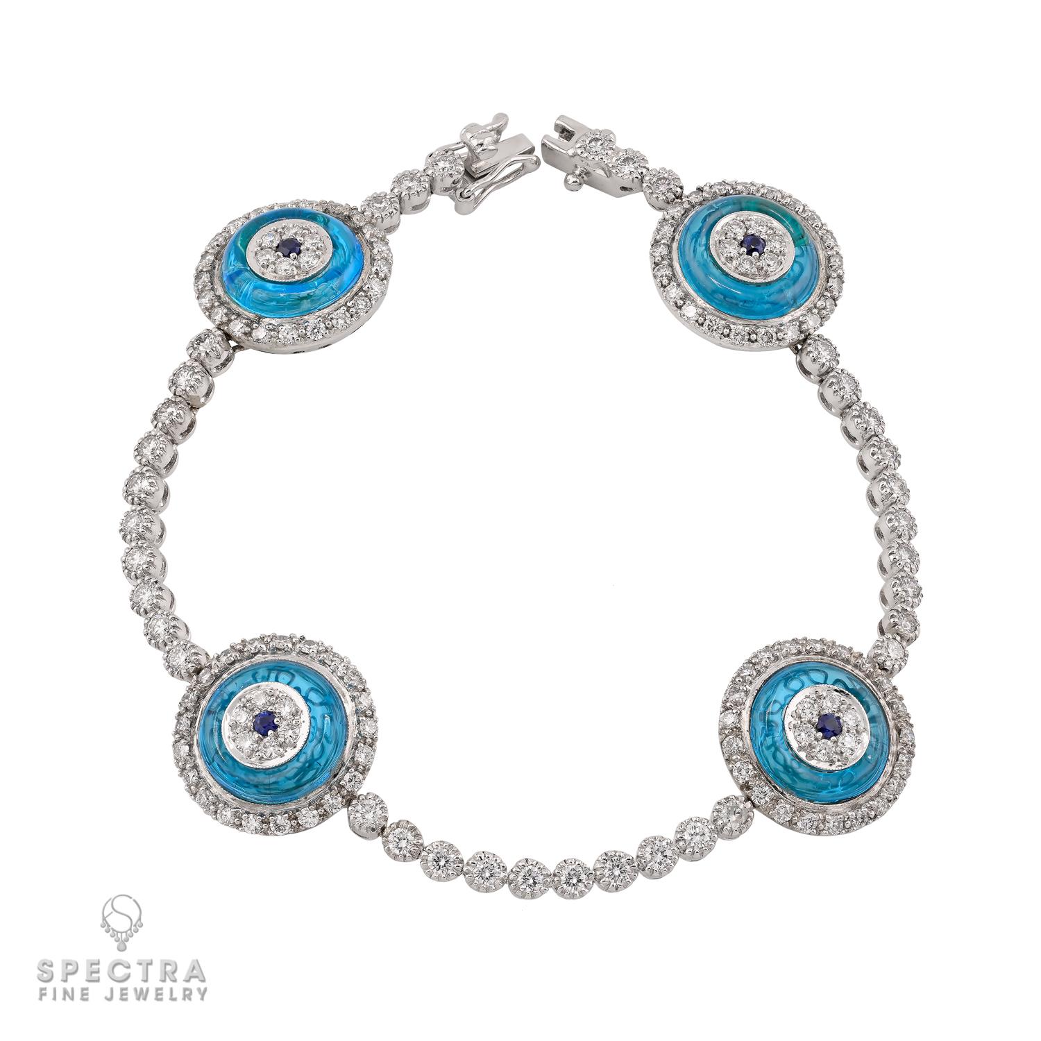 A modern talisman with timeless allure, this Diamond Sapphire Crystal ‘Against Evil Eye’ Bracelet combines symbolic meaning with refined luxury. Four round stations highlight vivid blue sapphire centers set within blue crystal, each encircled by a