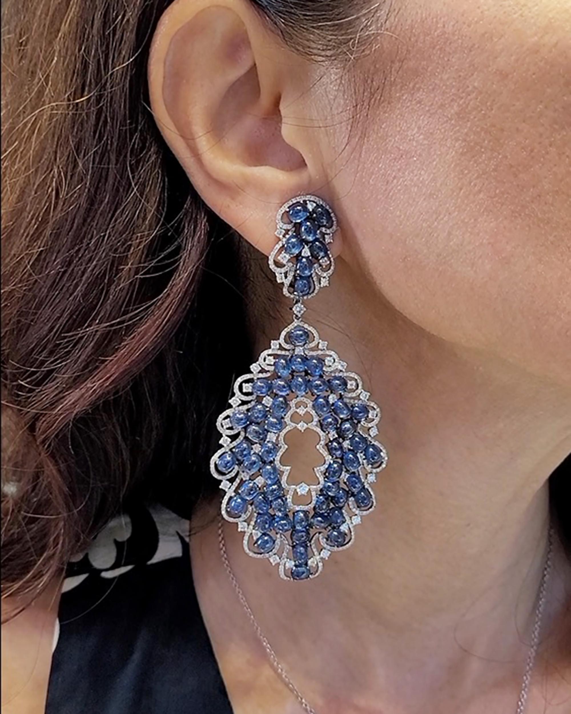Introducing our dazzling celestial creations: Diamond Sapphire 18K White Gold Chandelier Earrings! These earrings aren't just accessories; they're wearable constellations that will make you the star of any event.
Picture this: 6.94 carats of round