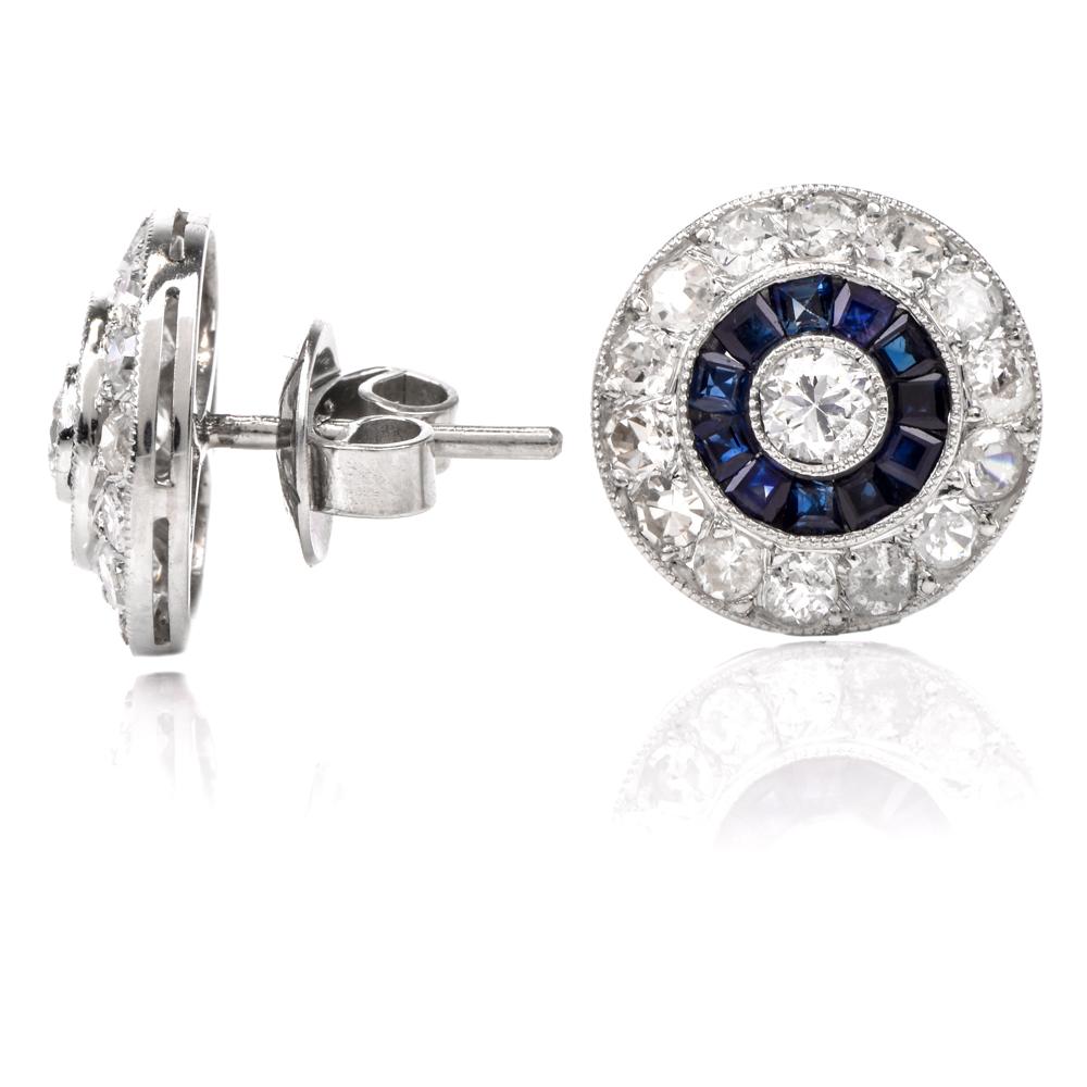 These diamond and sapphire circle stud earrings are crafted in solid platinum. Displaying 30 round-cut diamonds weighing approx. 1.60 carats, graded H-I color, and SI clarity. Further embellished by a middle ring of 24 genuine blue square-cute