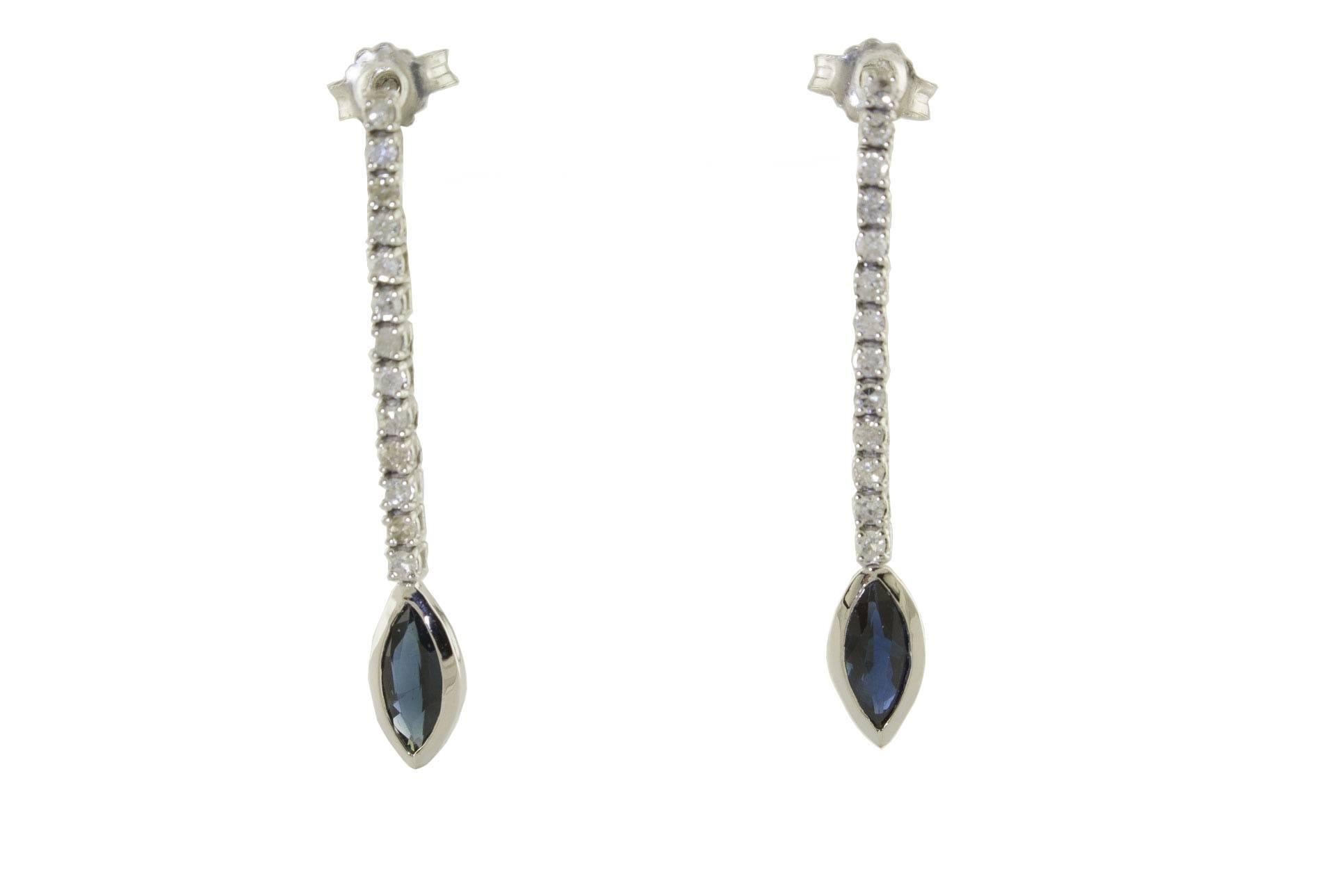 

Delightful dangle earrings in 14Kt white gold composed of a line of diamonds and at the end a drop of blue sapphire.
diamonds (0.52Kt)  
blue sapphire(1.09Kt)
tot weight 2.5gr 
rf.911648 
For any enquires, please contact the seller through the