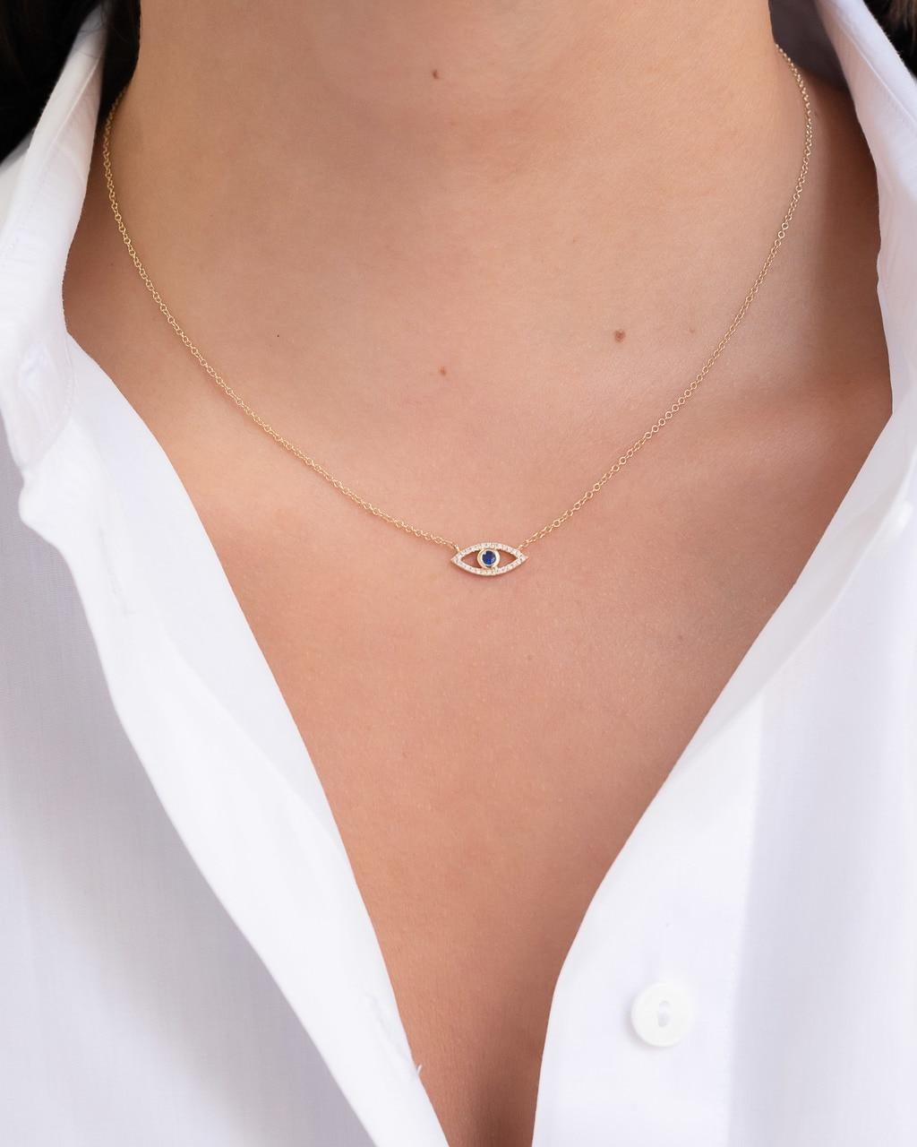 14k solid gold and pave diamond evil eye charm with a sapphire stone centered and hanging from an adjustable 16''-18'' cable link necklace. Dainty and perfect to wear by itself or layered.

Size of evil eye: Approx. 0.5''(H) by 0.7''(W)
Carat