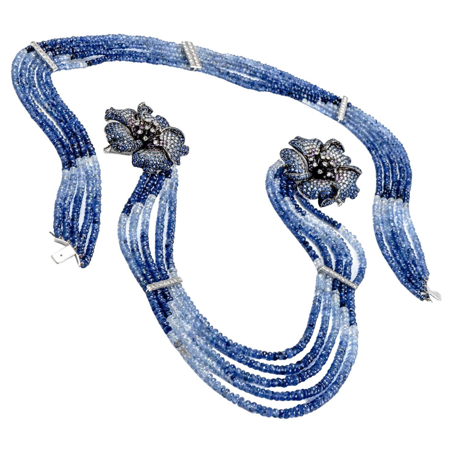 Bask in the beauty of this refreshingly decadent Diamond Sapphire 18K Gold Flower Multistrand Ombre Necklace Brooch! 

This necklace has 5 ombre strands of light to dark-colored genuine blue sapphire beads, with 6 rows of genuine glittering diamonds