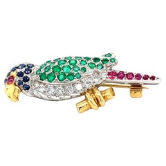 Diamond sapphire green emerald and ruby brooch 18k white gold
