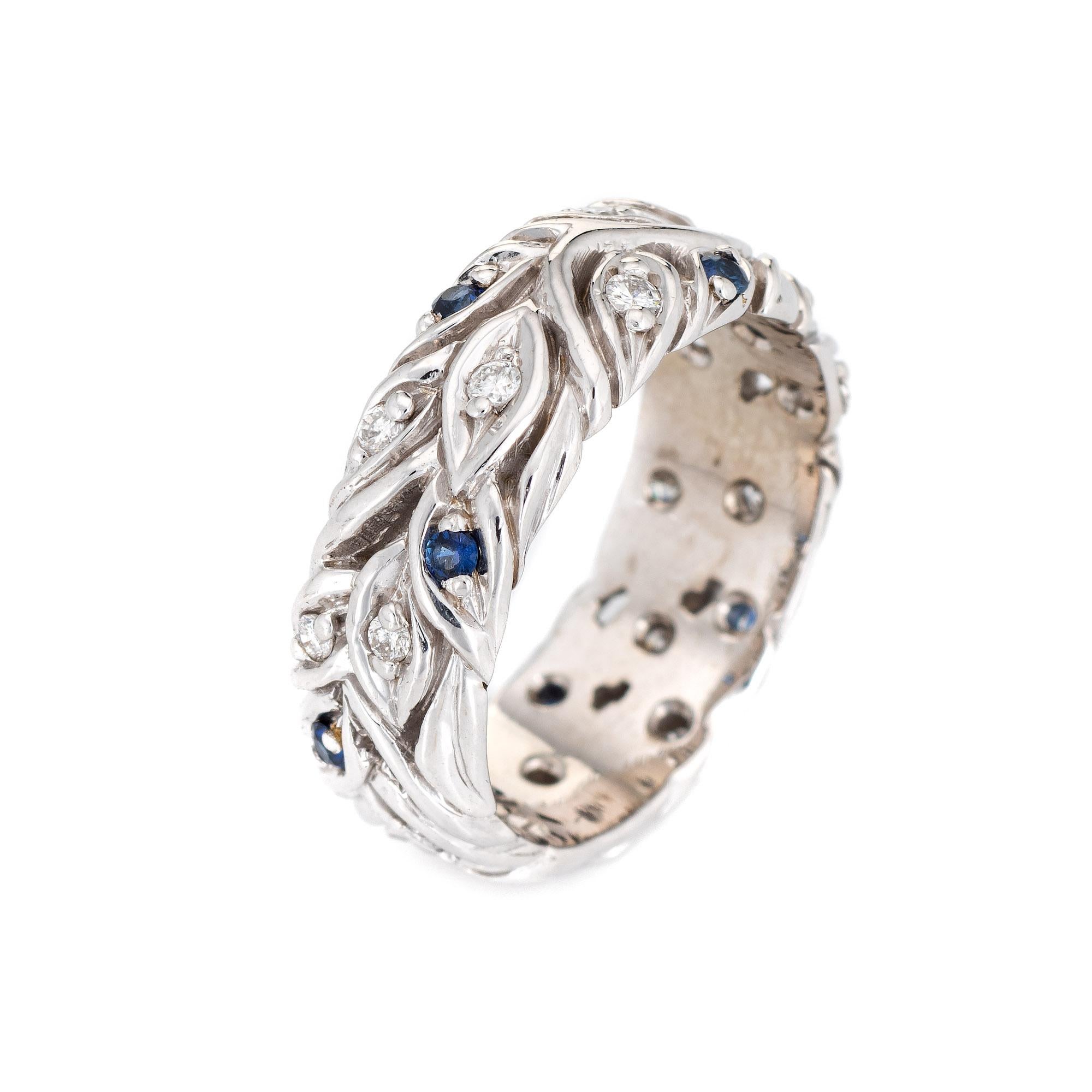 Stylish vintage blue sapphire & diamond eternity ring crafted in 18 karat white gold. 

17 diamonds total an estimated 0.17 carats (estimated at H-I color and VS2-SI1 clarity). 14 blue sapphires are estimated at 0.01 carats each and total an